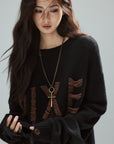 Low pixel Distressed Letter Embroidered Oversized Knit Sweater