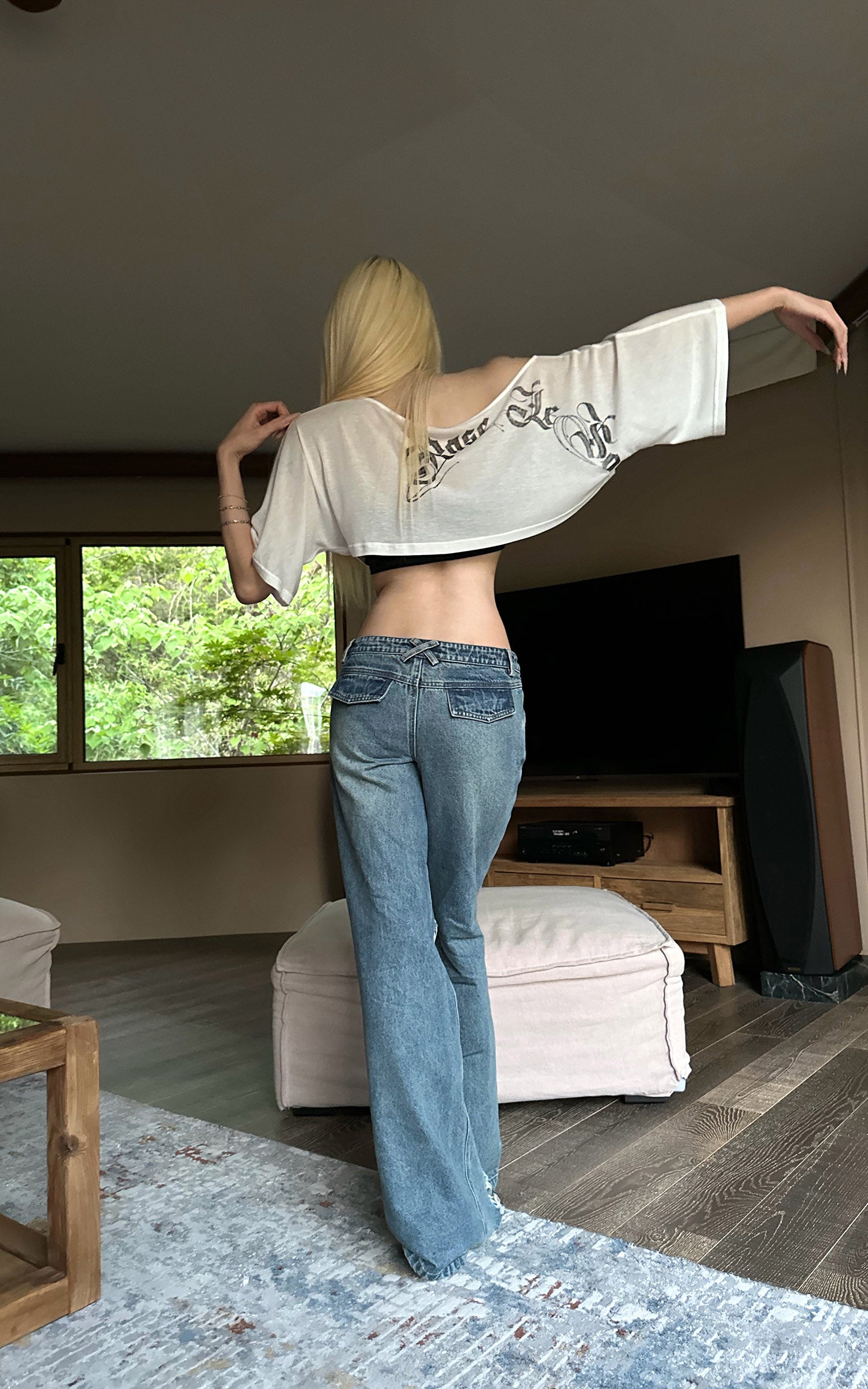 Rase le sol Jean évasé taille basse à franges effet usé