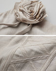 DOINDULGE Draped Maxi Dress with Corset Waist and Rosette Detail