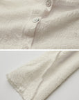 DOINDULGE Textured Knit Asymmetric Buttoned Long Sleeve Top