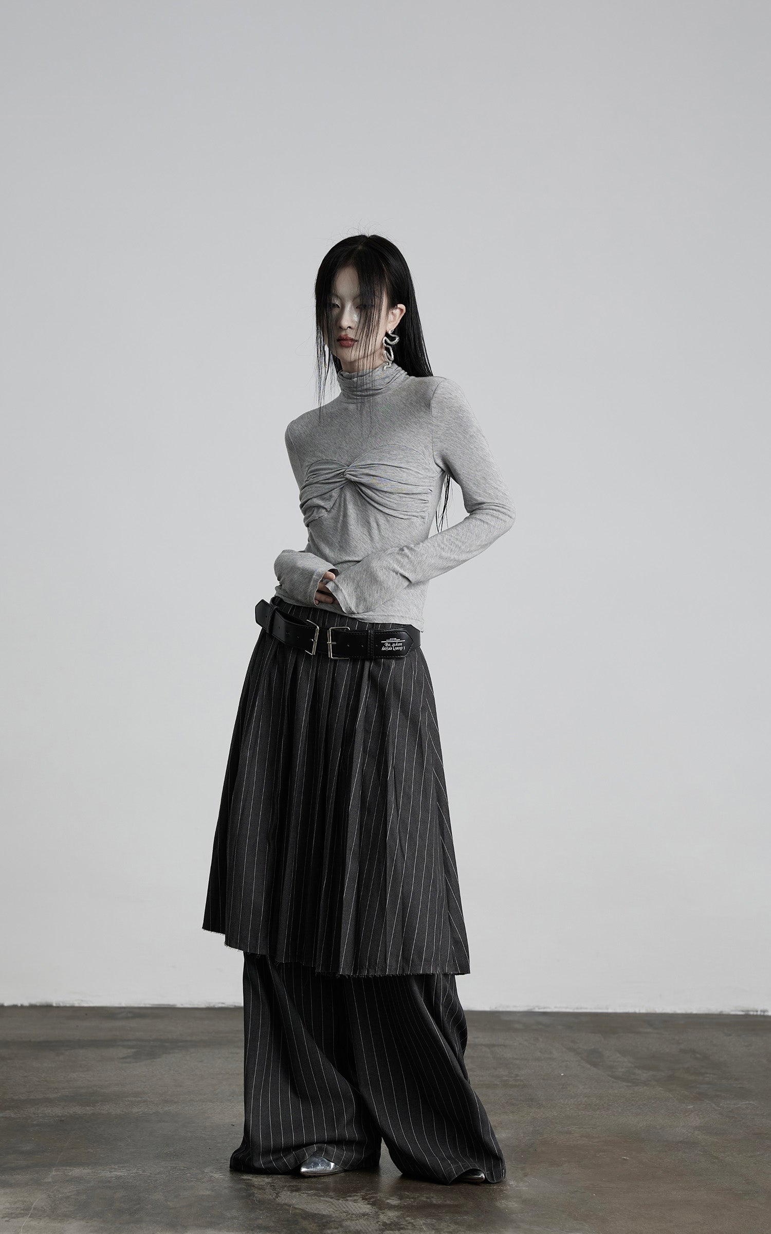 DOINDULGE Draped Twist Knit Top with High Neck and Long Sleeves