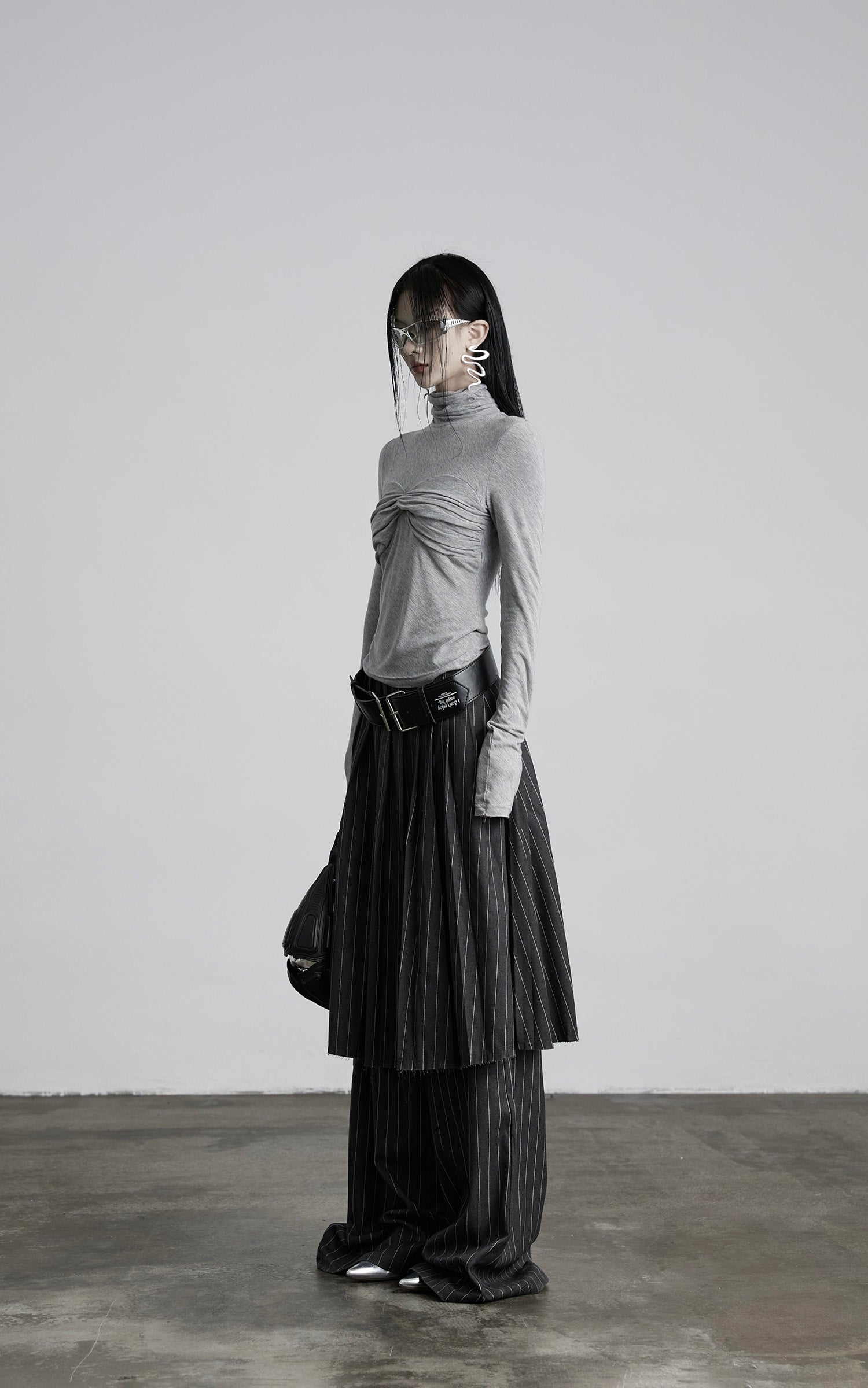 DOINDULGE Draped Twist Knit Top with High Neck and Long Sleeves