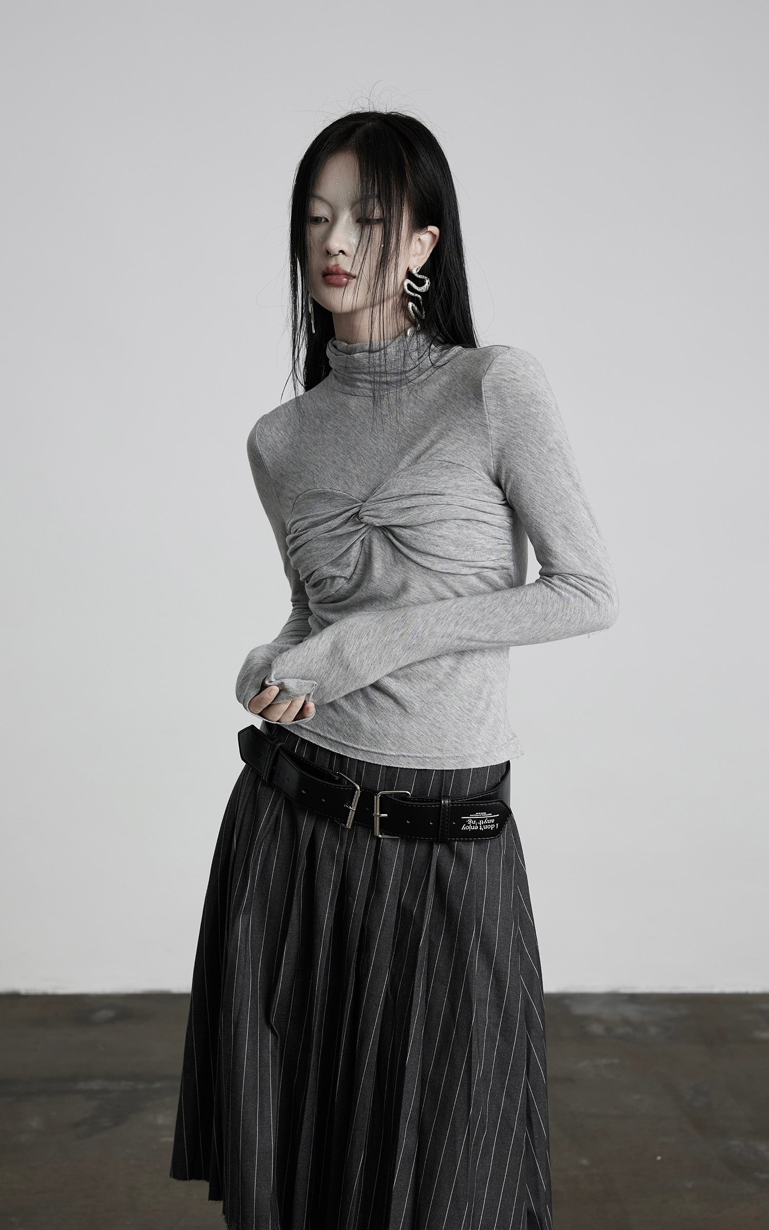 DOINDULGE Draped Twist Knit Top with High Neck and Long Sleeves