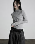 DOINDULGE Draped Twist Knit Top with High Neck and Long Sleeves