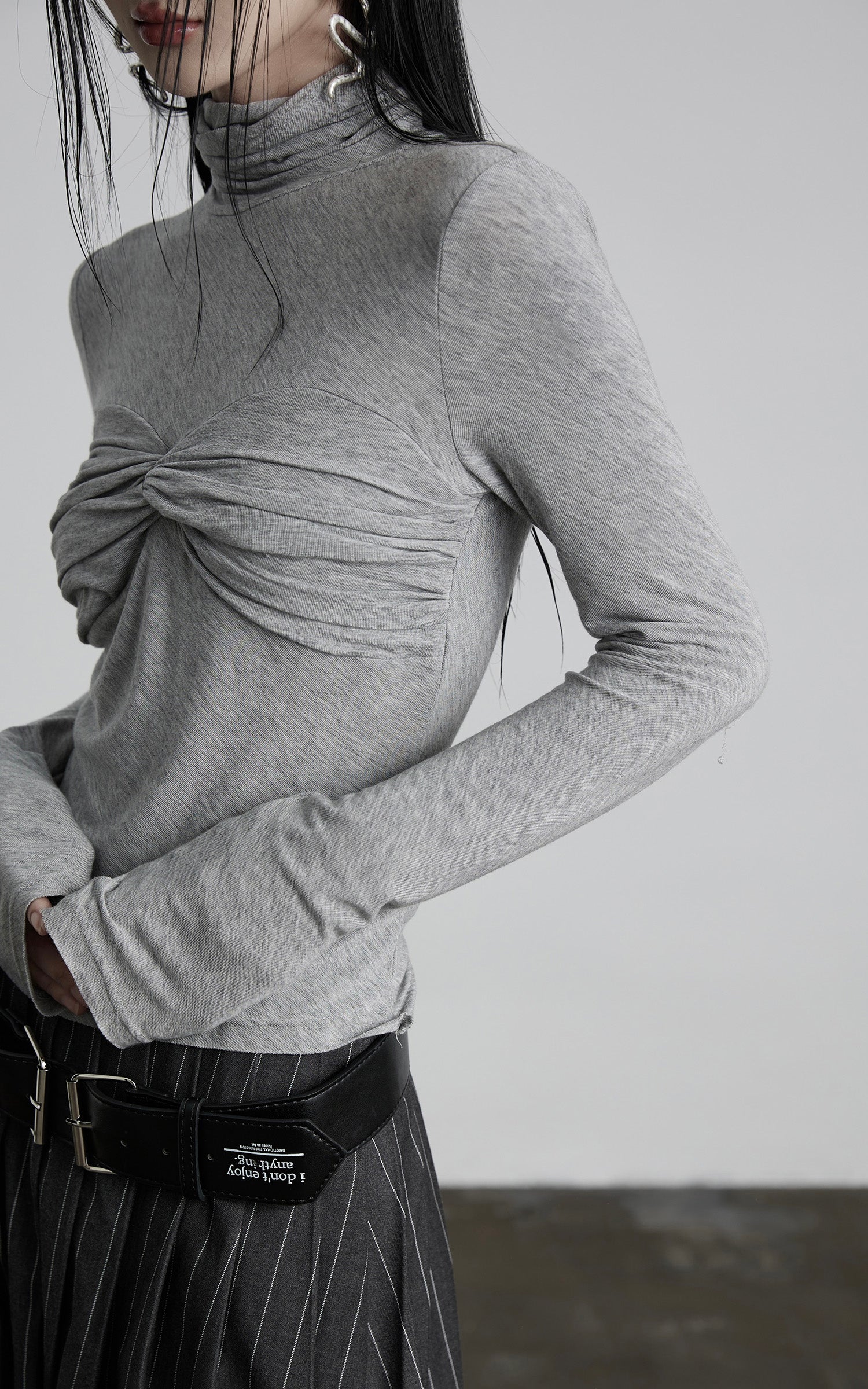 DOINDULGE Draped Twist Knit Top with High Neck and Long Sleeves
