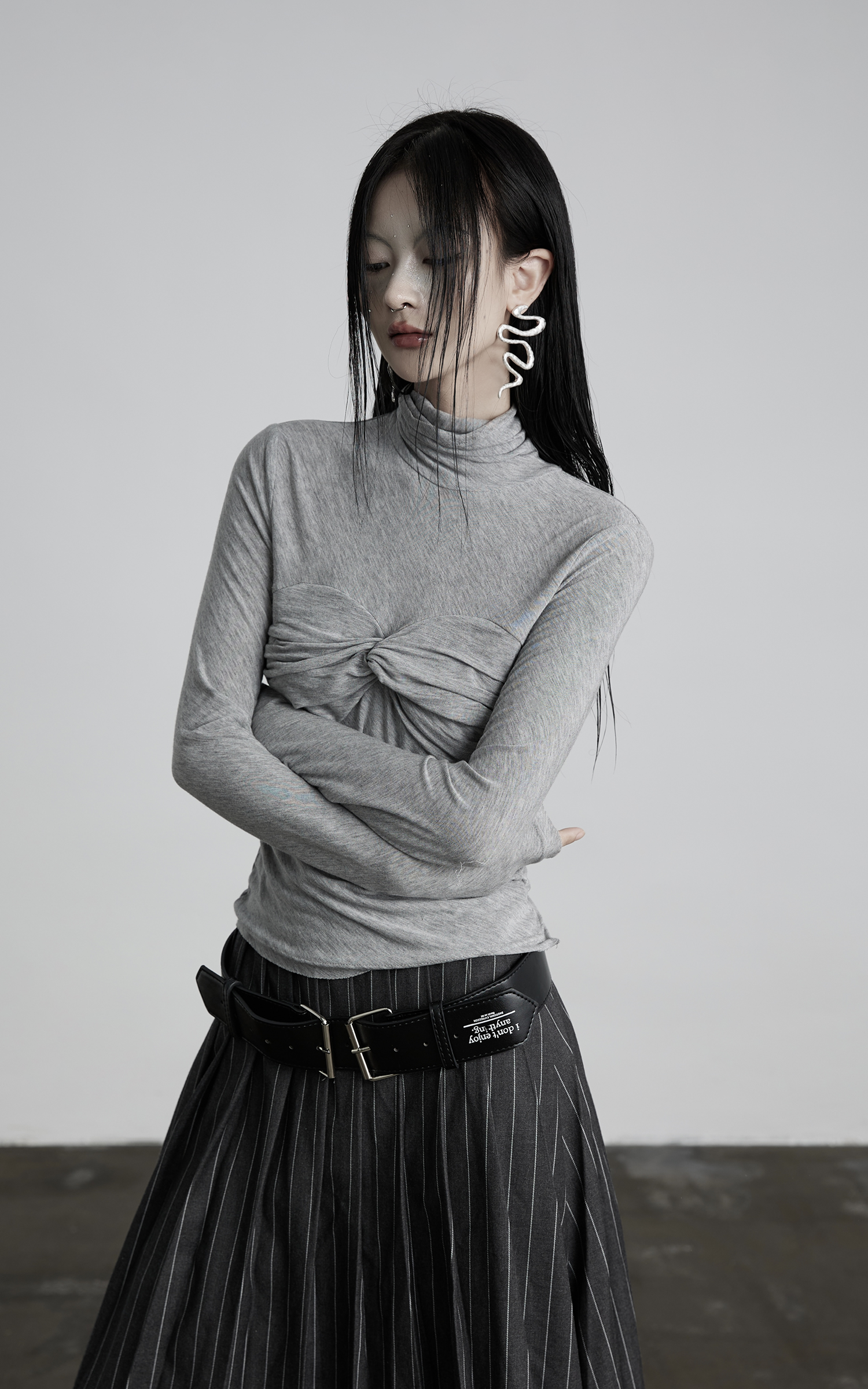 DOINDULGE Draped Twist Knit Top with High Neck and Long Sleeves