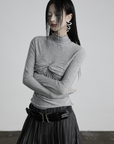 DOINDULGE Draped Twist Knit Top with High Neck and Long Sleeves