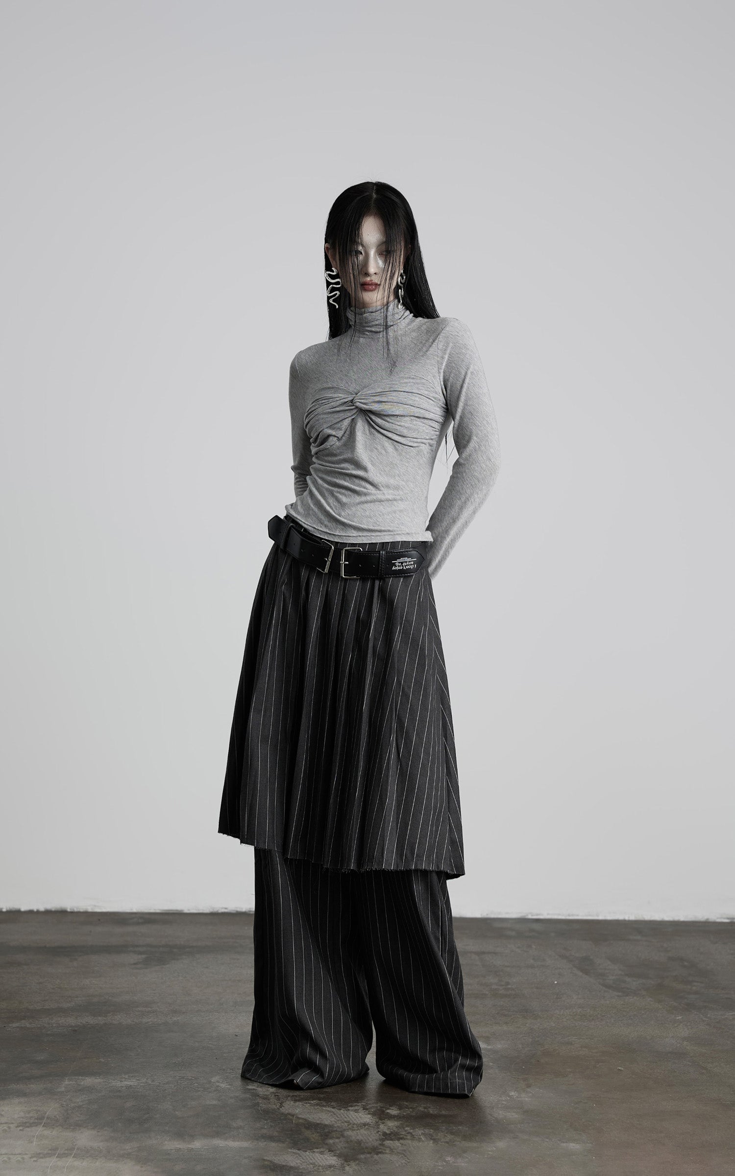 DOINDULGE Draped Twist Knit Top with High Neck and Long Sleeves