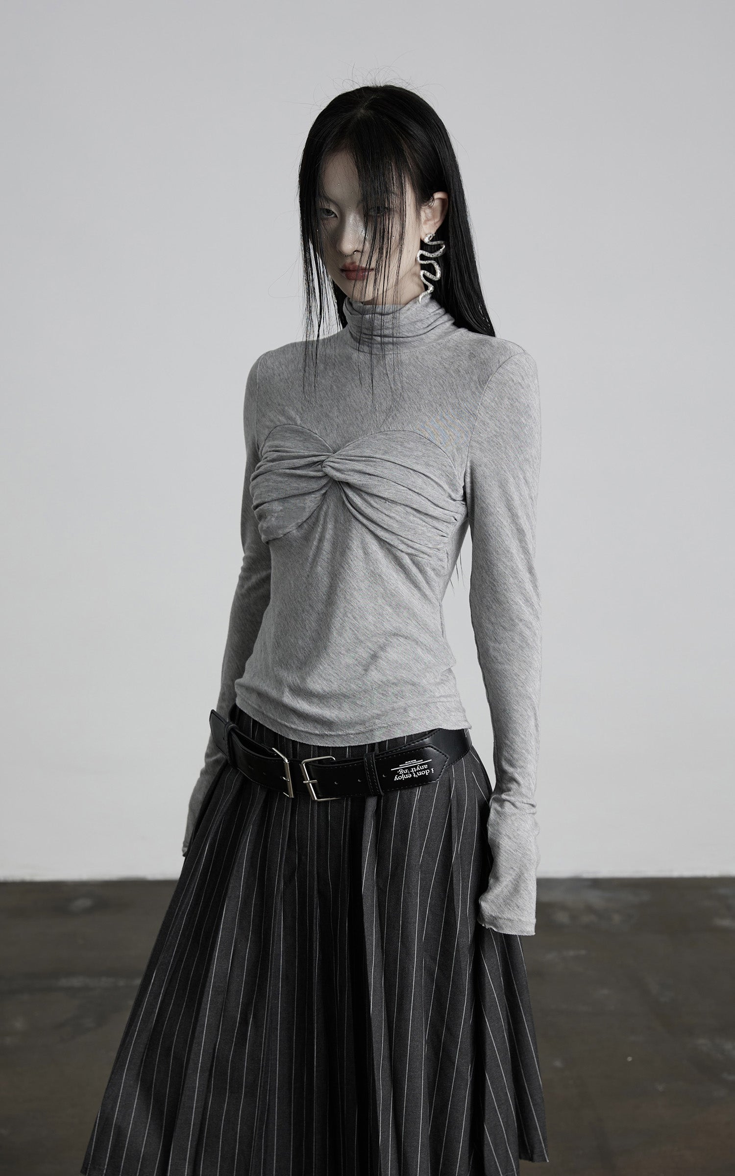 DOINDULGE Draped Twist Knit Top with High Neck and Long Sleeves