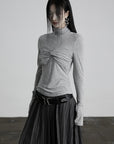 DOINDULGE Draped Twist Knit Top with High Neck and Long Sleeves