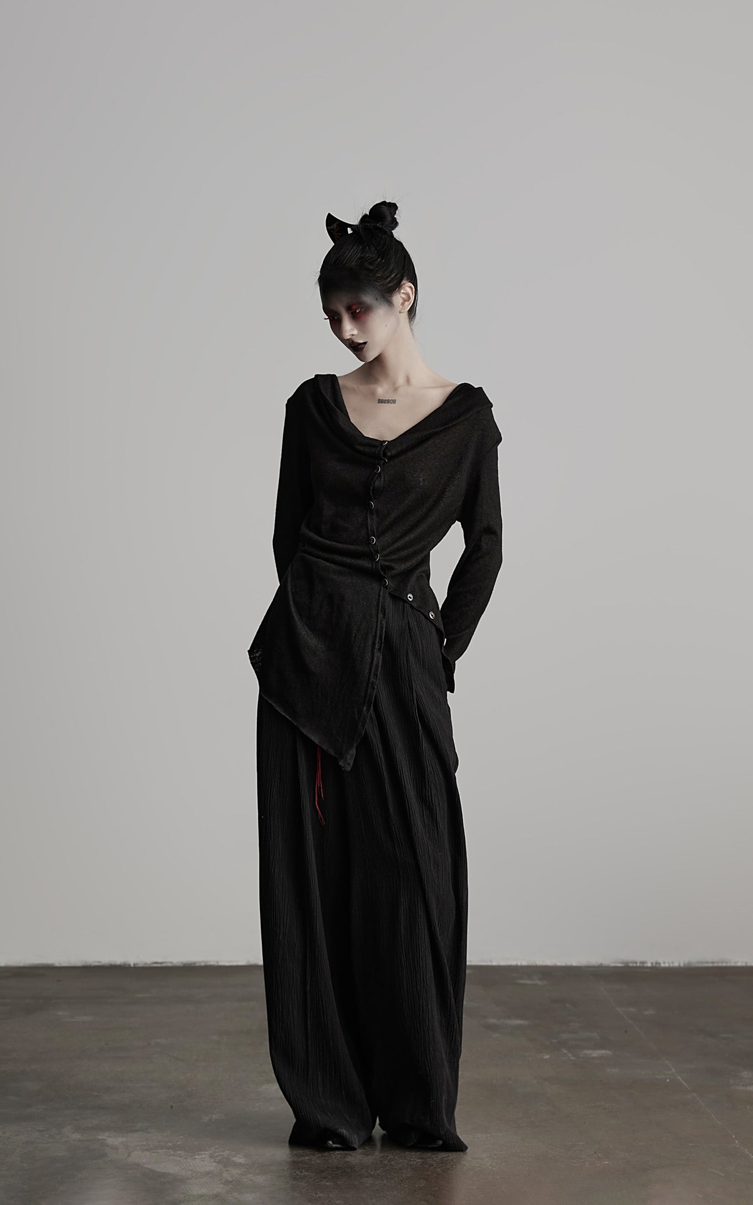 DOINDULGE Asymmetric Drape Long Sleeve Top with Deconstructed Button Design
