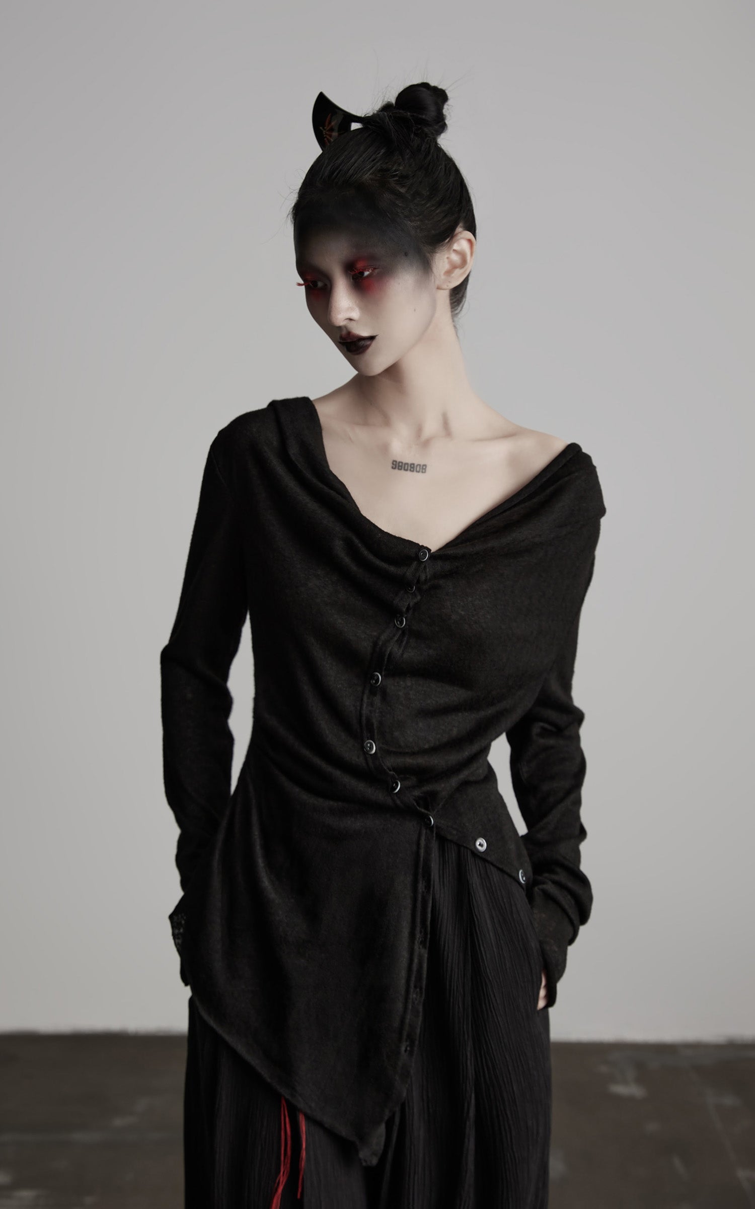 DOINDULGE Asymmetric Drape Long Sleeve Top with Deconstructed Button Design