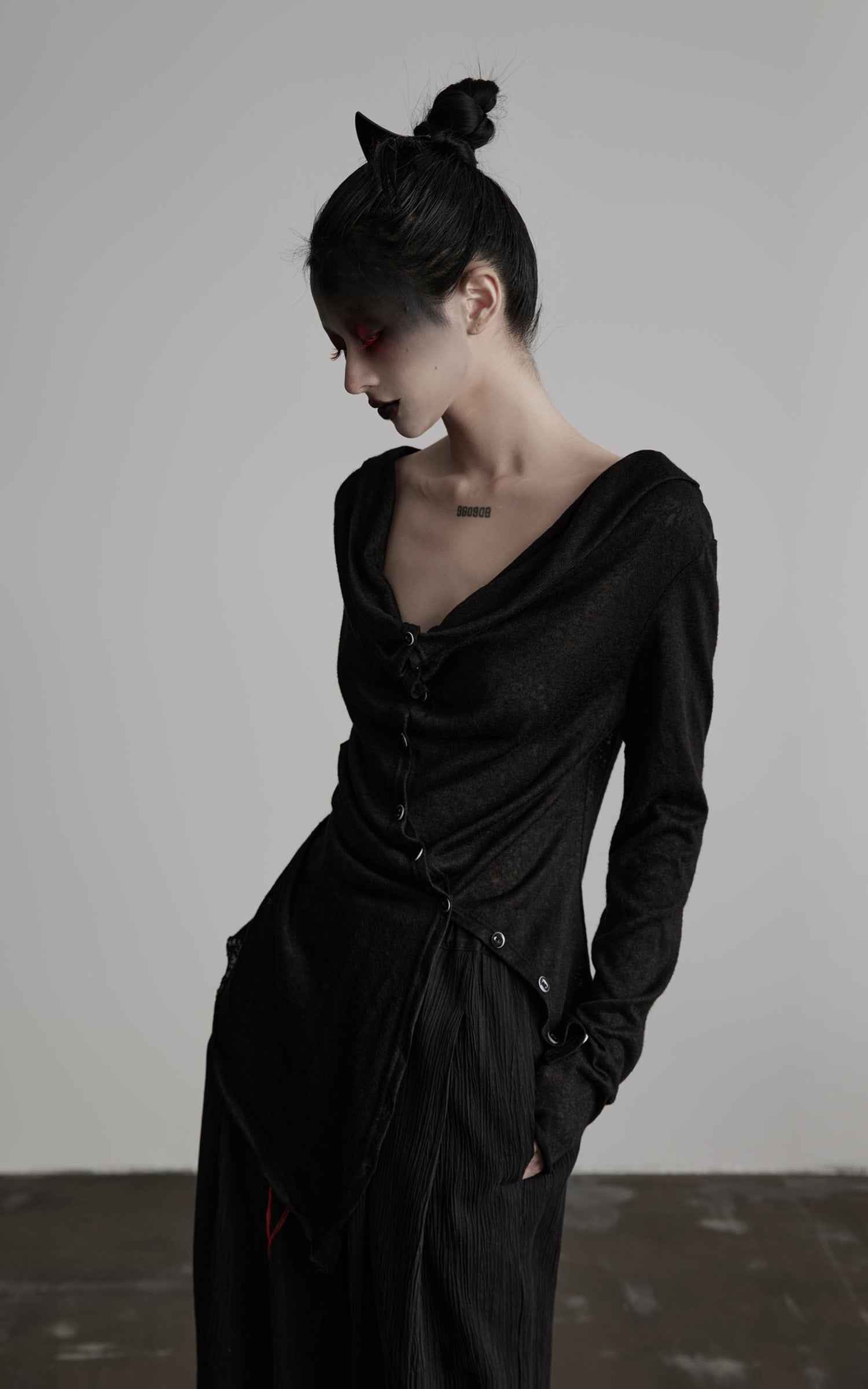 DOINDULGE Asymmetric Drape Long Sleeve Top with Deconstructed Button Design