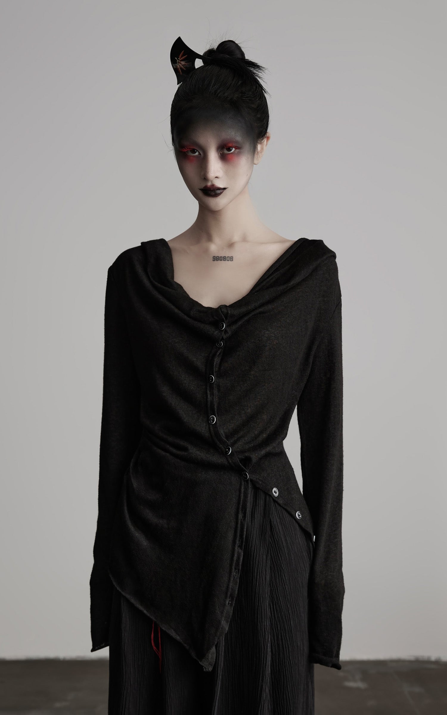 DOINDULGE Asymmetric Drape Long Sleeve Top with Deconstructed Button Design