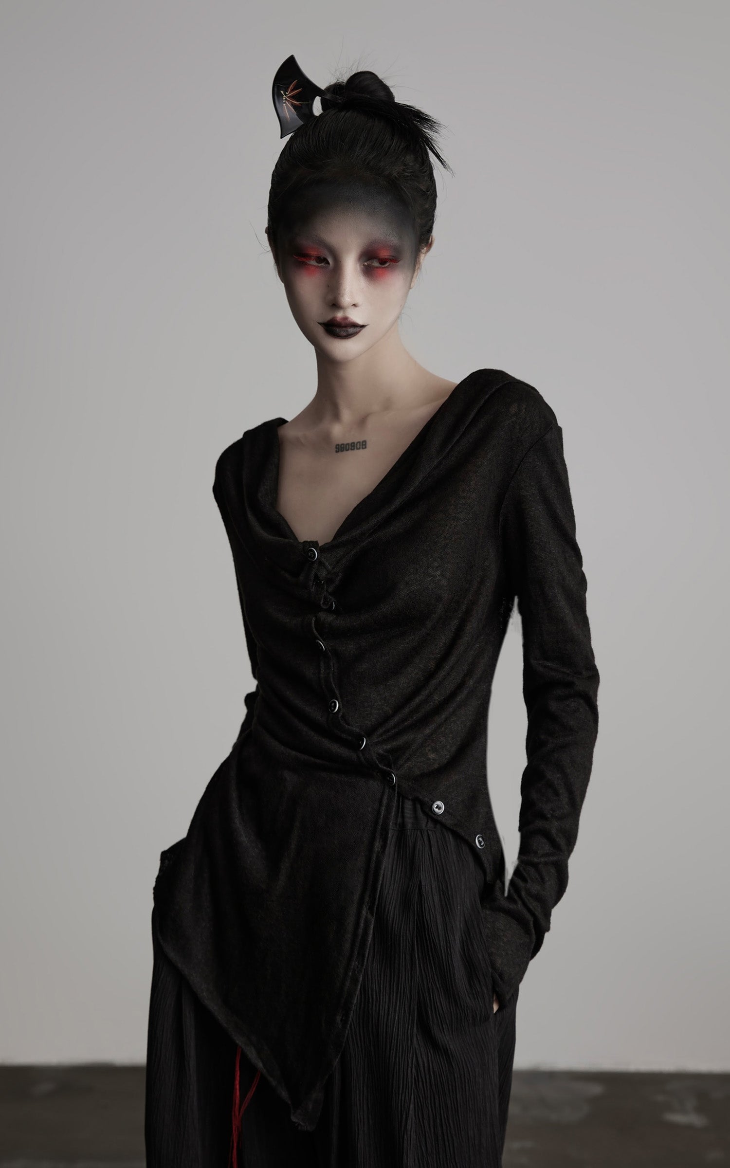 DOINDULGE Asymmetric Drape Long Sleeve Top with Deconstructed Button Design