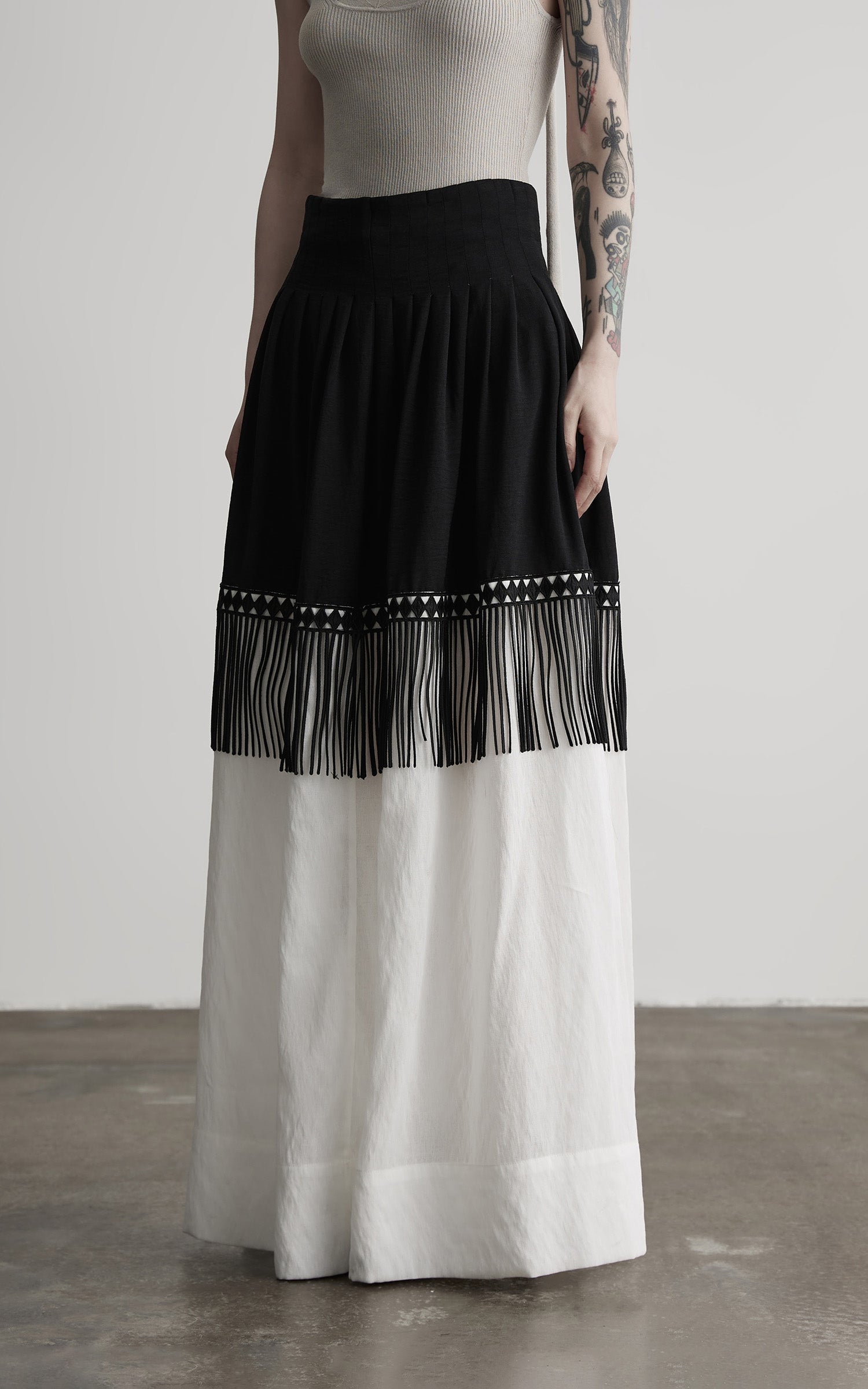 DOINDULGE Fringe Paneled Layered Skirt with Pleats and Contrast Hem