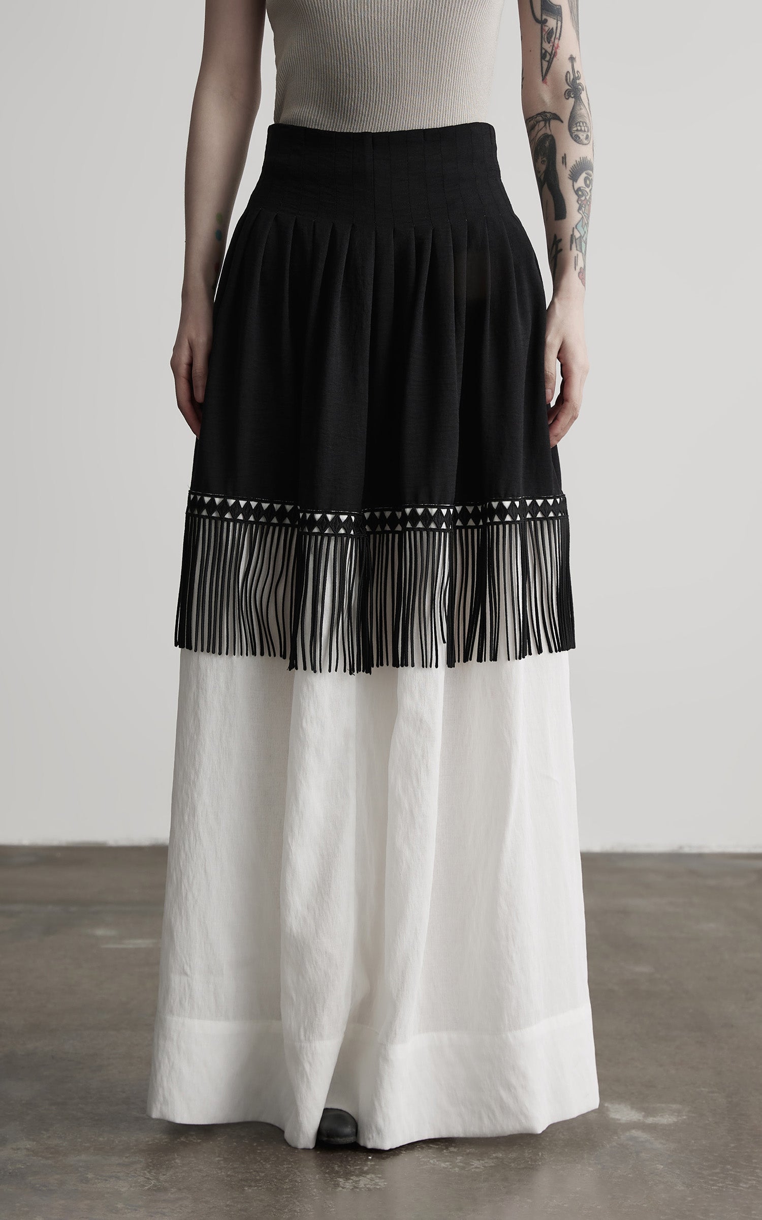 DOINDULGE Fringe Paneled Layered Skirt with Pleats and Contrast Hem