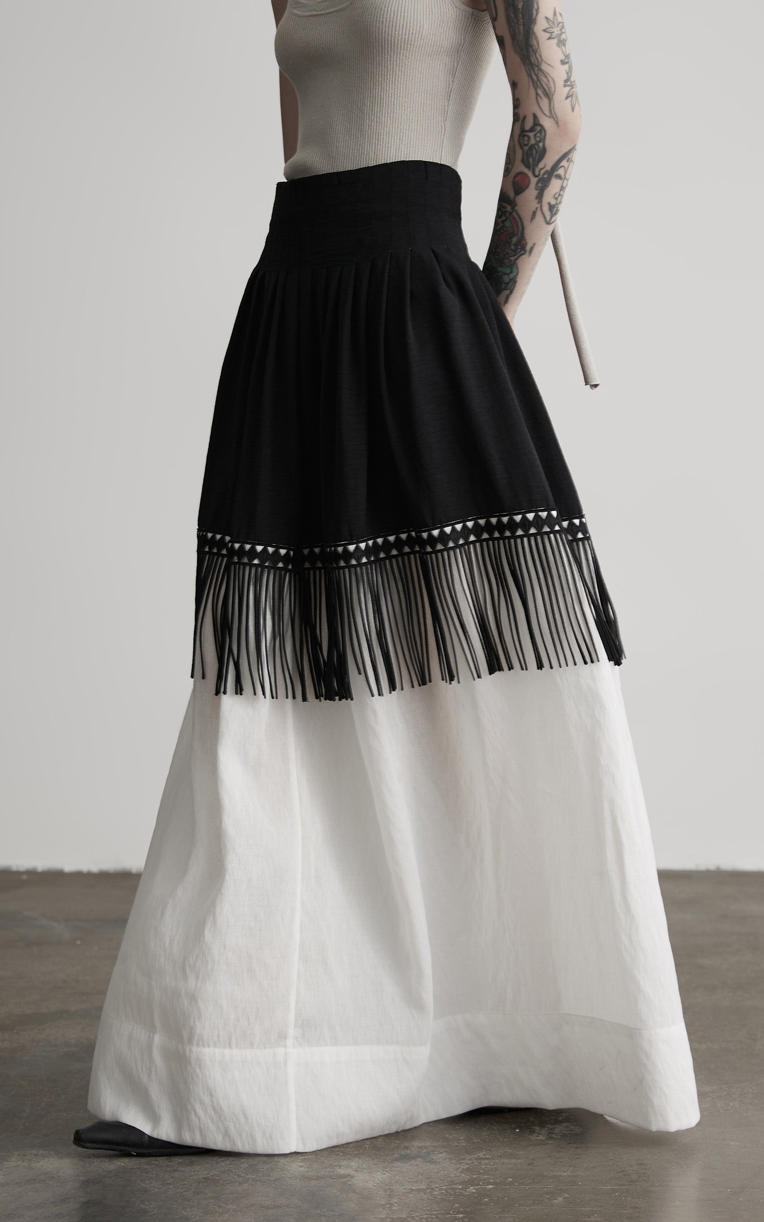DOINDULGE Fringe Paneled Layered Skirt with Pleats and Contrast Hem
