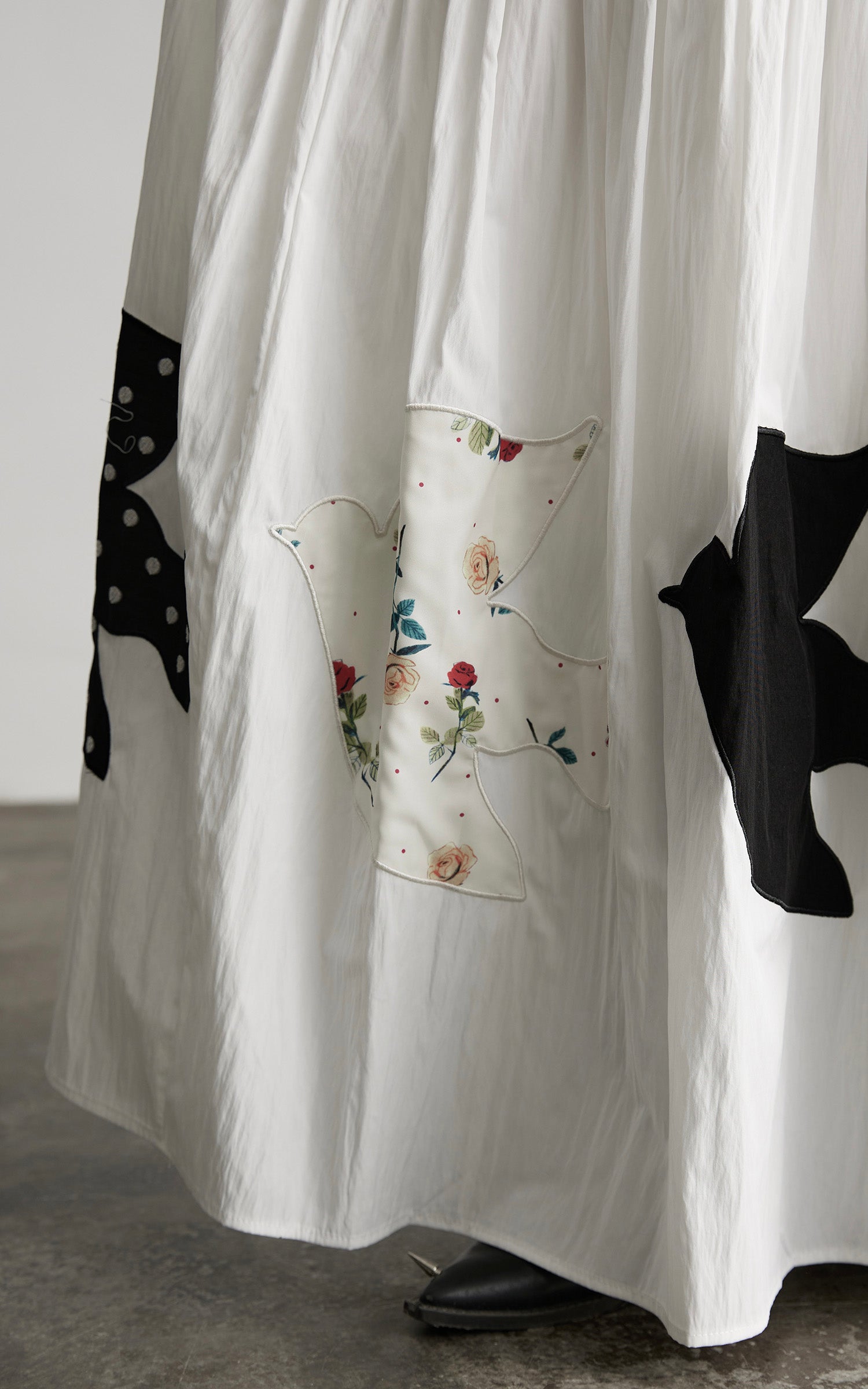DOINDULGE Bird Patch Panel Maxi Skirt with Raw Volume Silhouette