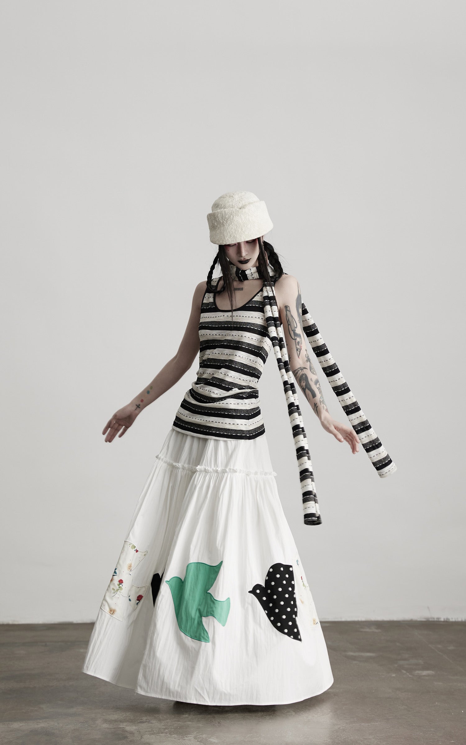DOINDULGE Bird Patch Panel Maxi Skirt with Raw Volume Silhouette
