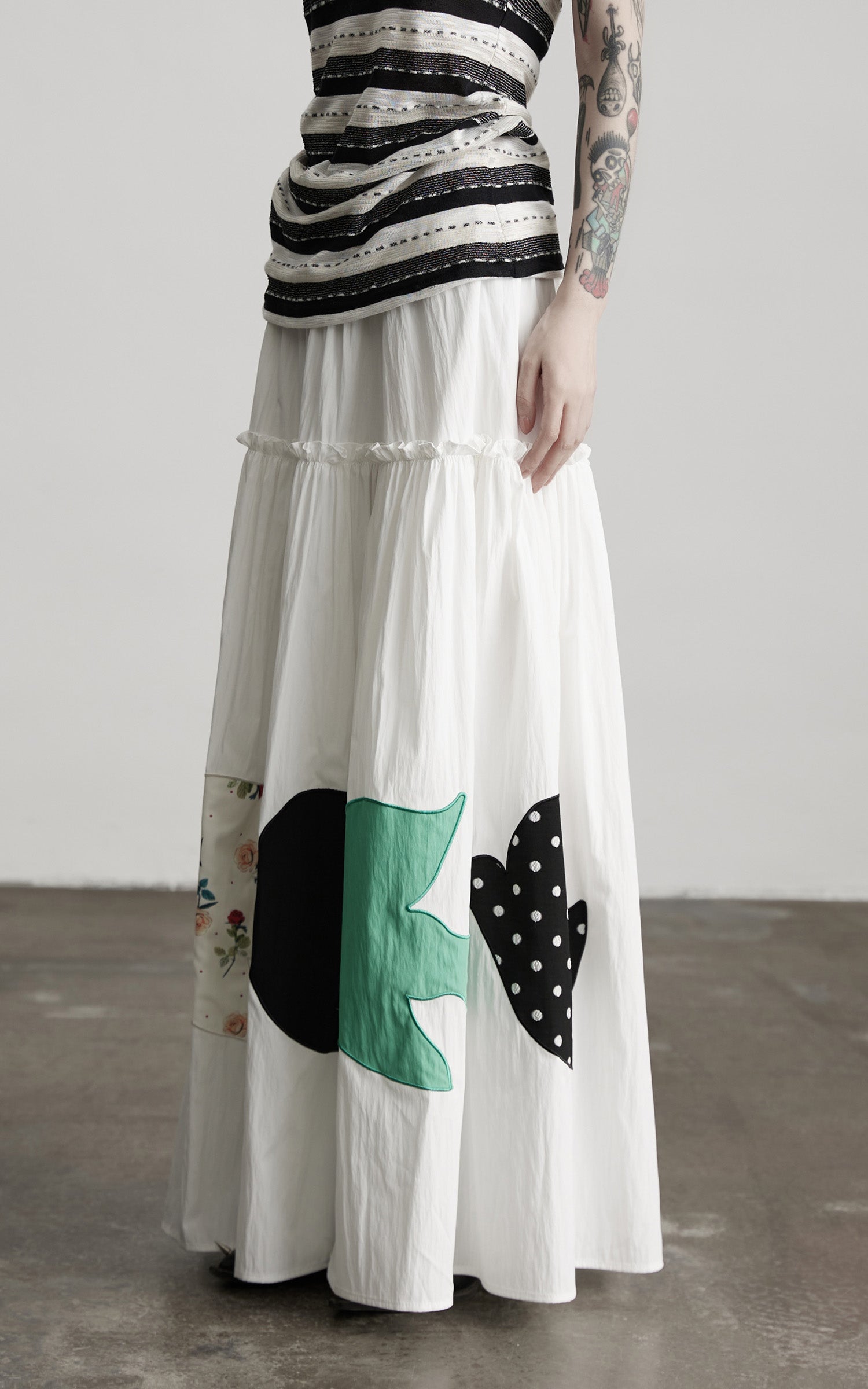 DOINDULGE Bird Patch Panel Maxi Skirt with Raw Volume Silhouette