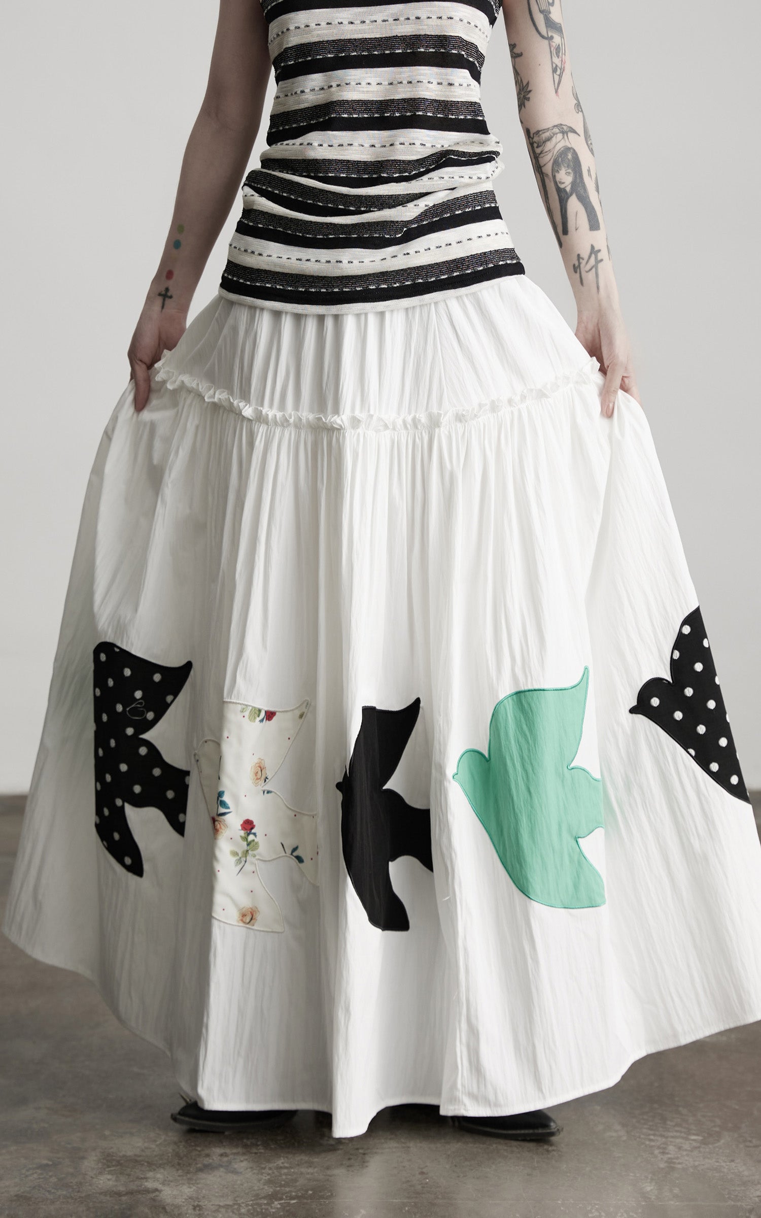 DOINDULGE Bird Patch Panel Maxi Skirt with Raw Volume Silhouette