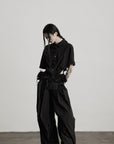 DOINDULGE Wide-Leg Draped Pants with Fringed Panels and Deconstructed Details