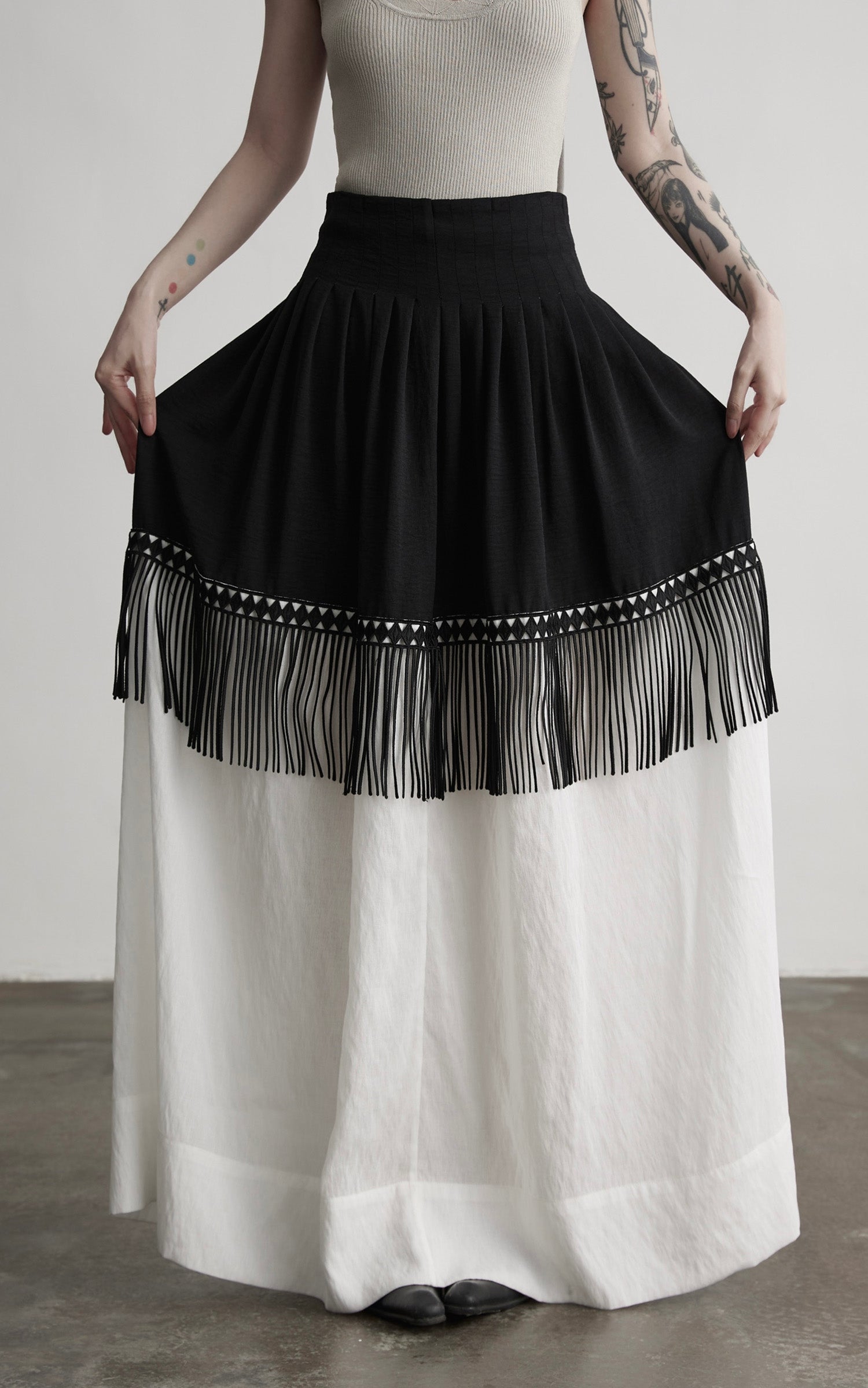 DOINDULGE Fringe Paneled Layered Skirt with Pleats and Contrast Hem