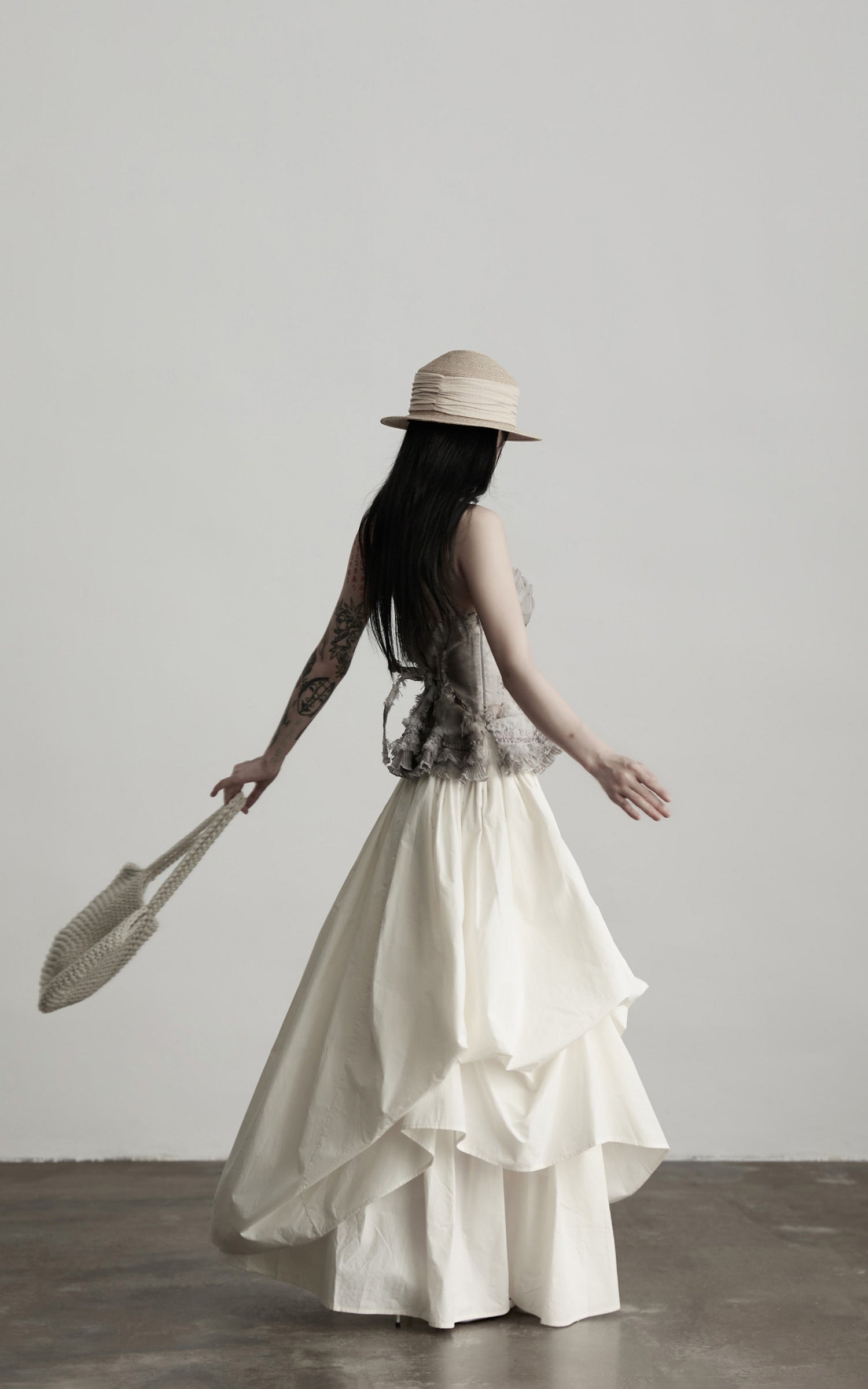 DOINDULGE Layered Cotton Skirt with Asymmetric Draped Hem