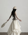 DOINDULGE Layered Cotton Skirt with Asymmetric Draped Hem