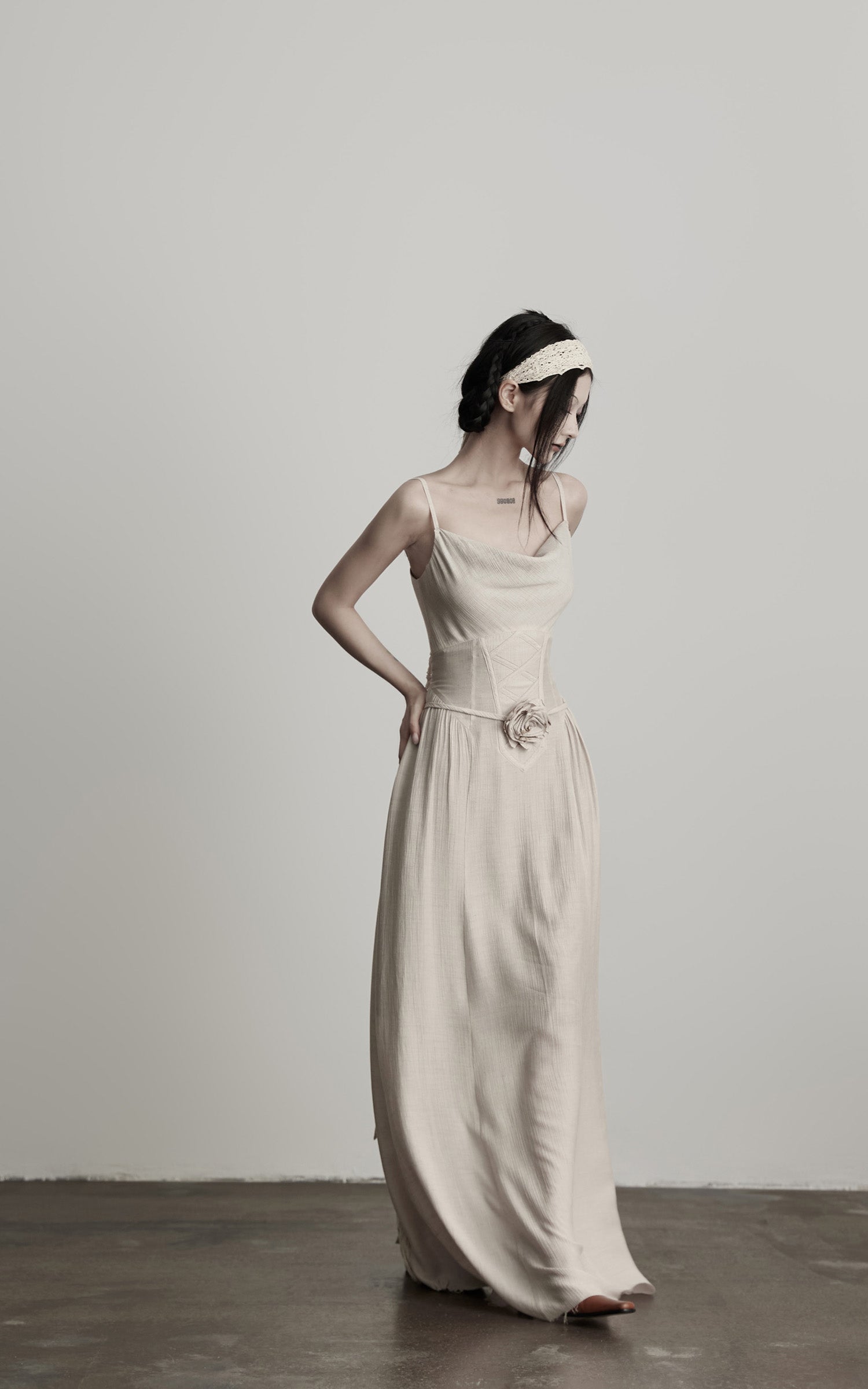 DOINDULGE Draped Maxi Dress with Corset Waist and Rosette Detail