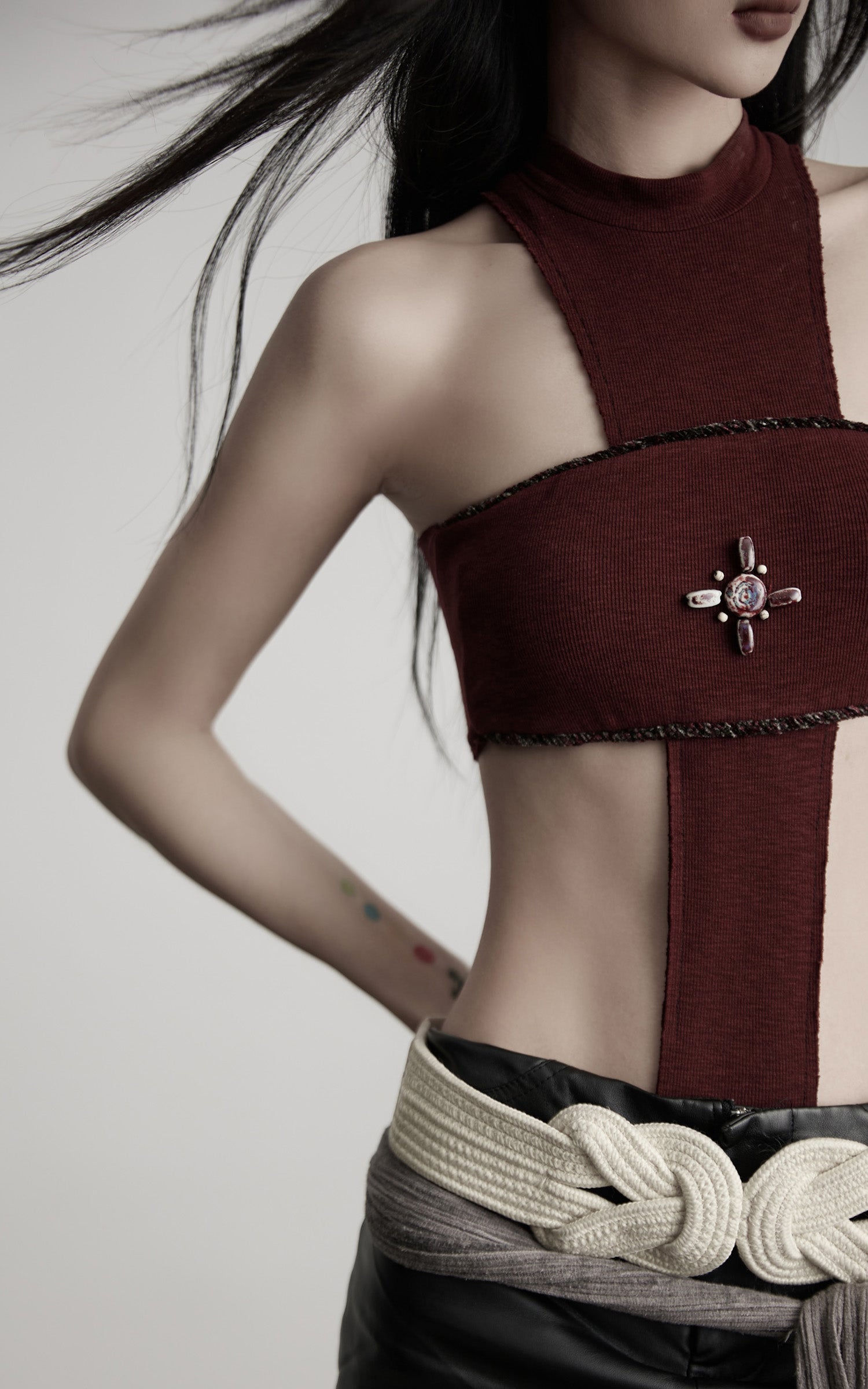 DOINDULGE Asymmetric Cutout Bodysuit with Ceramic Cross Embellishment