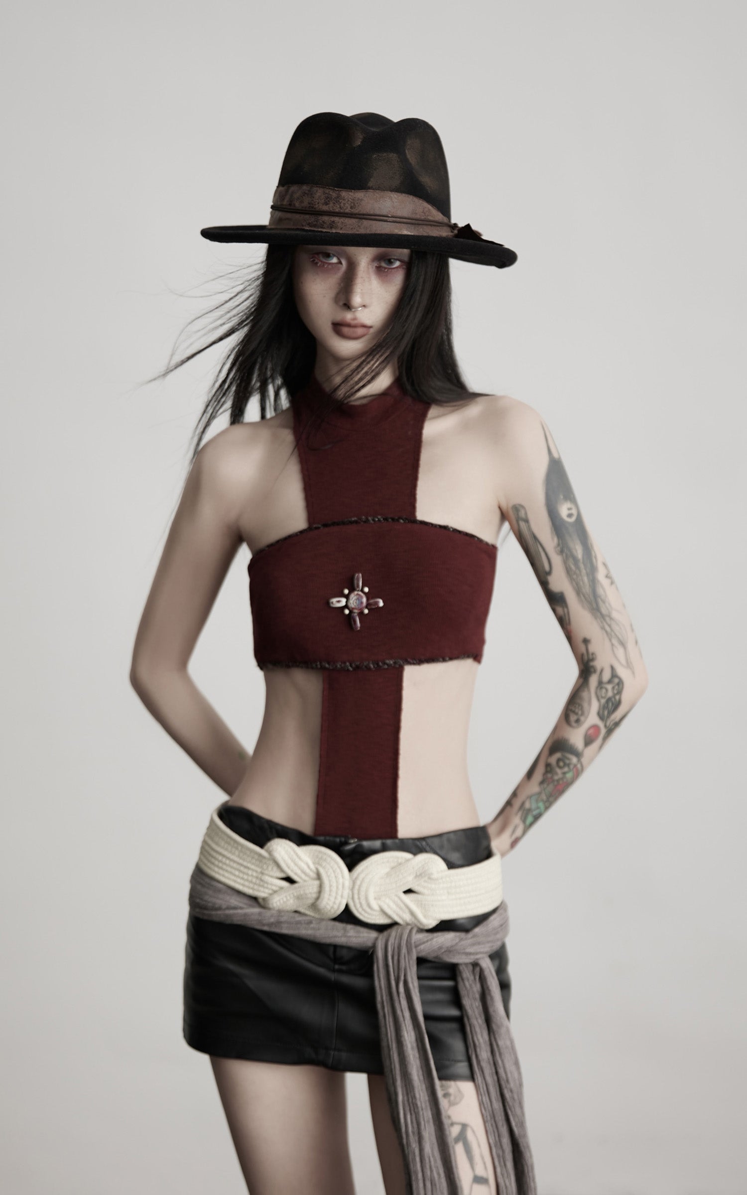 DOINDULGE Asymmetric Cutout Bodysuit with Ceramic Cross Embellishment