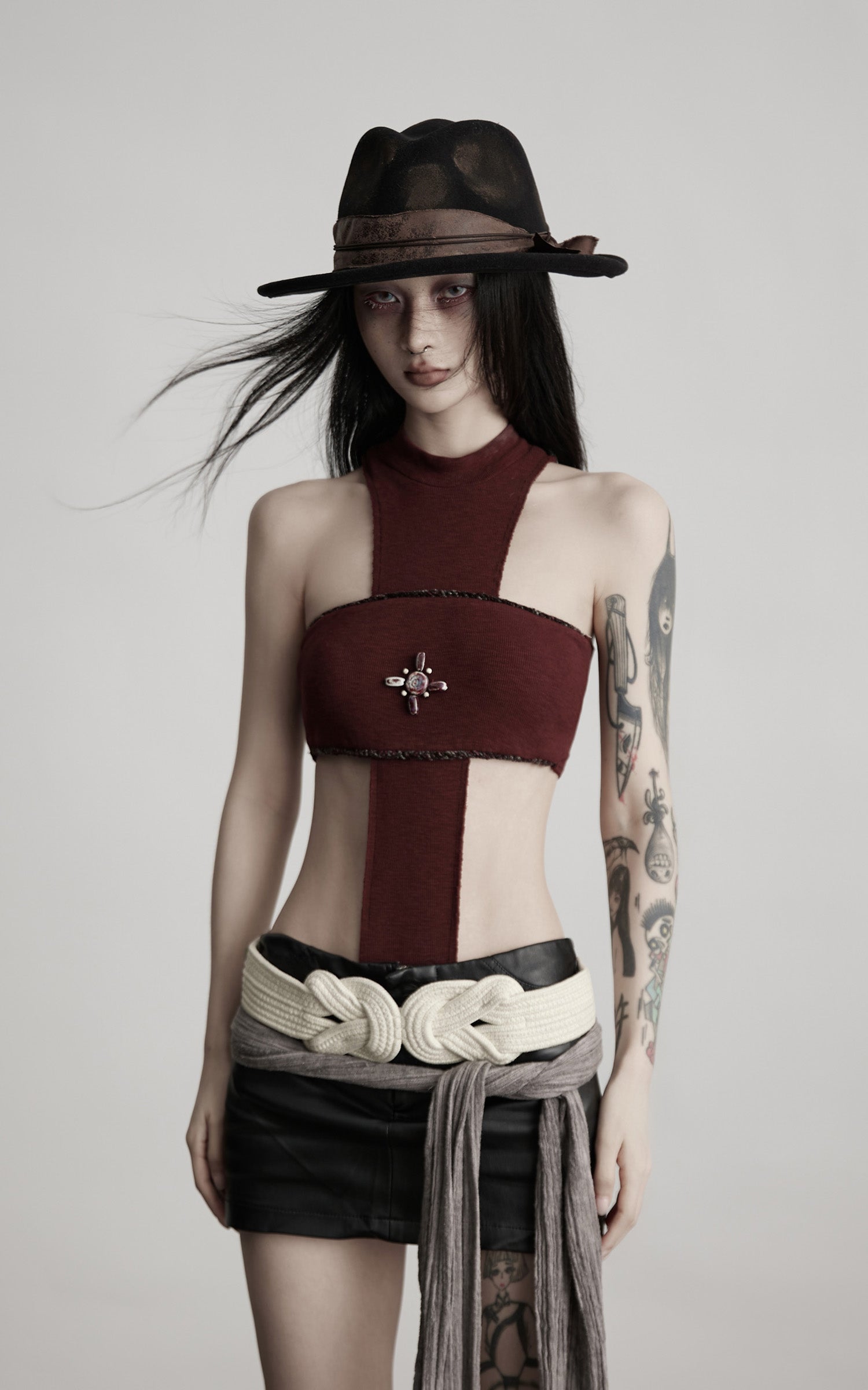 DOINDULGE Asymmetric Cutout Bodysuit with Ceramic Cross Embellishment