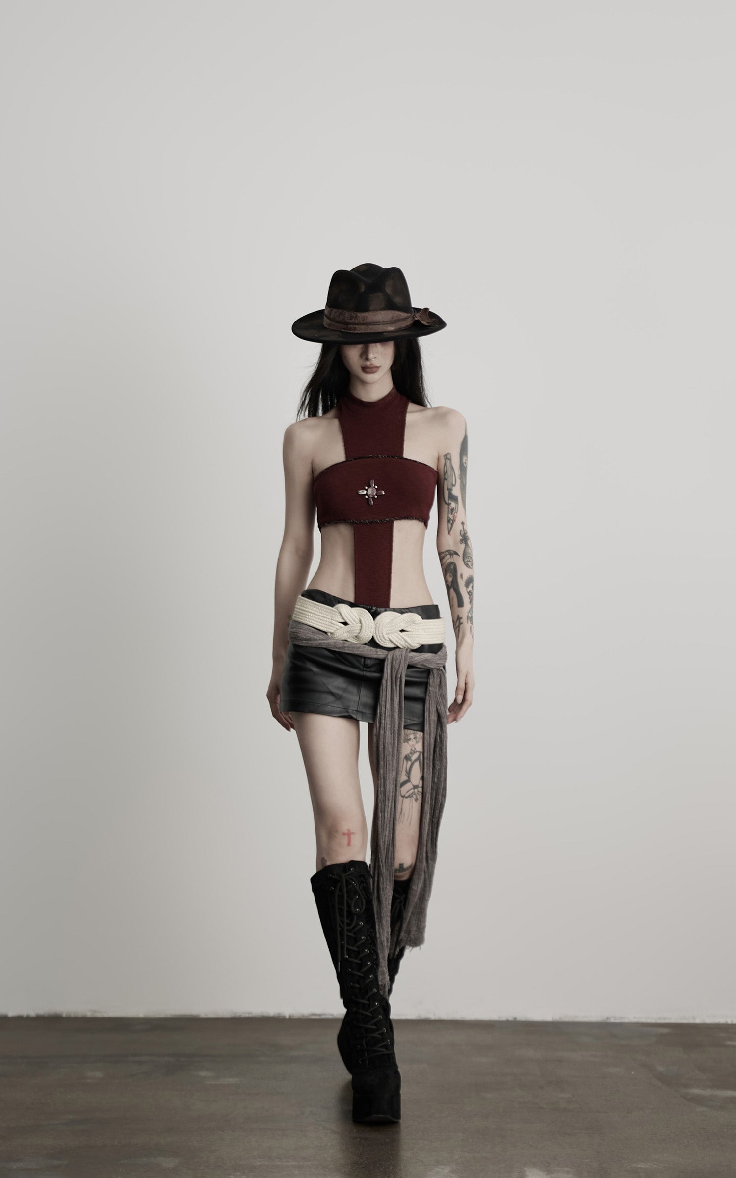 DOINDULGE Asymmetric Cutout Bodysuit with Ceramic Cross Embellishment