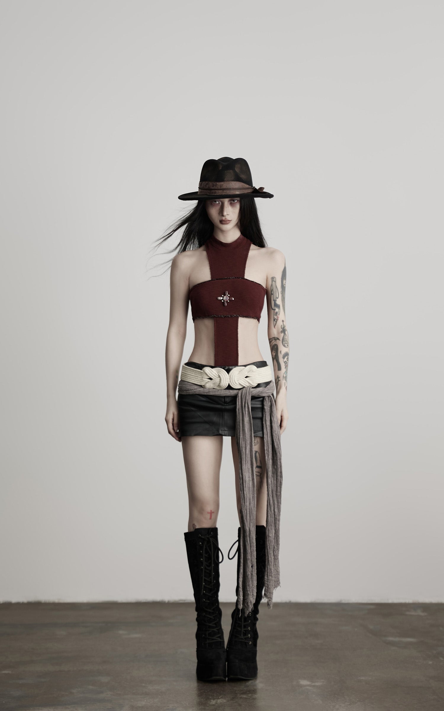 DOINDULGE Asymmetric Cutout Bodysuit with Ceramic Cross Embellishment