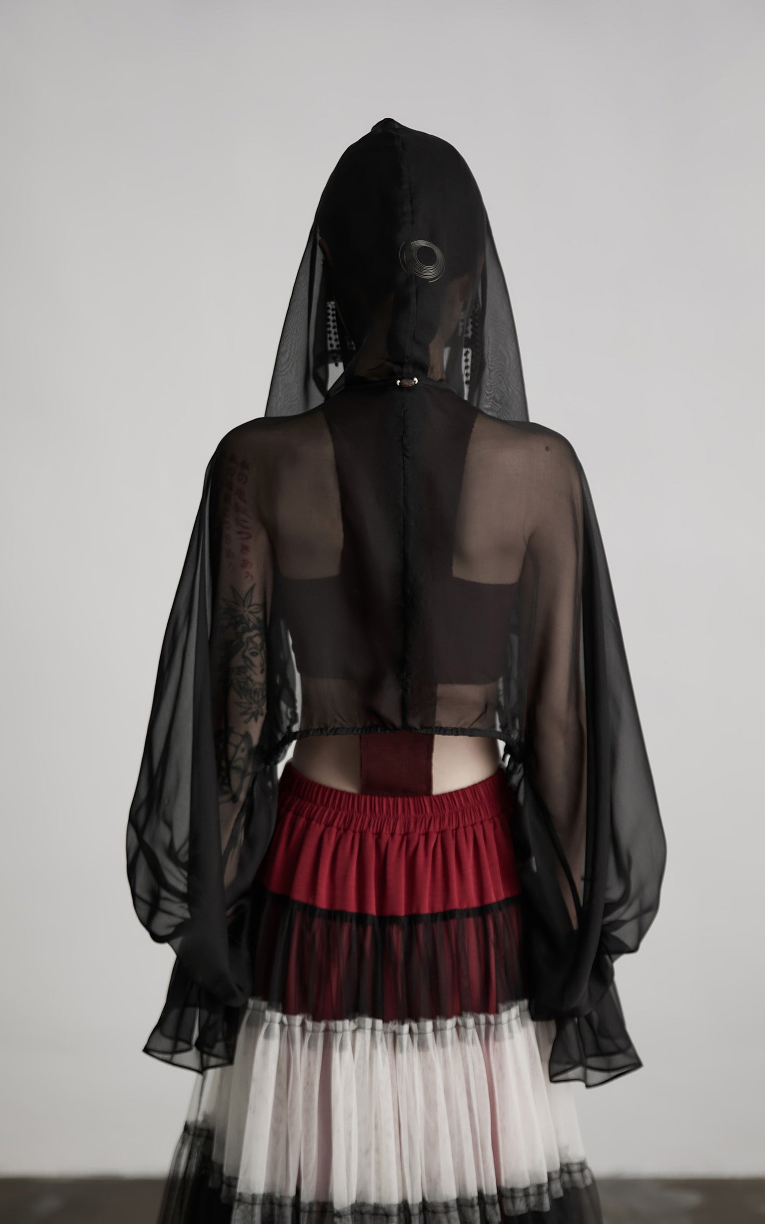 DOINDULGE Draped Mesh Hooded Cardigan with Tassel Accents and Voluminous Sleeves