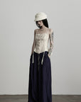 DOINDULGE Wide-Leg Pants with Contrast Waistband and Bead Detail