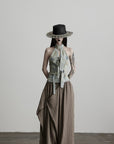 DOINDULGE Draped Asymmetric Wide-Leg Trousers in Textured Stripe