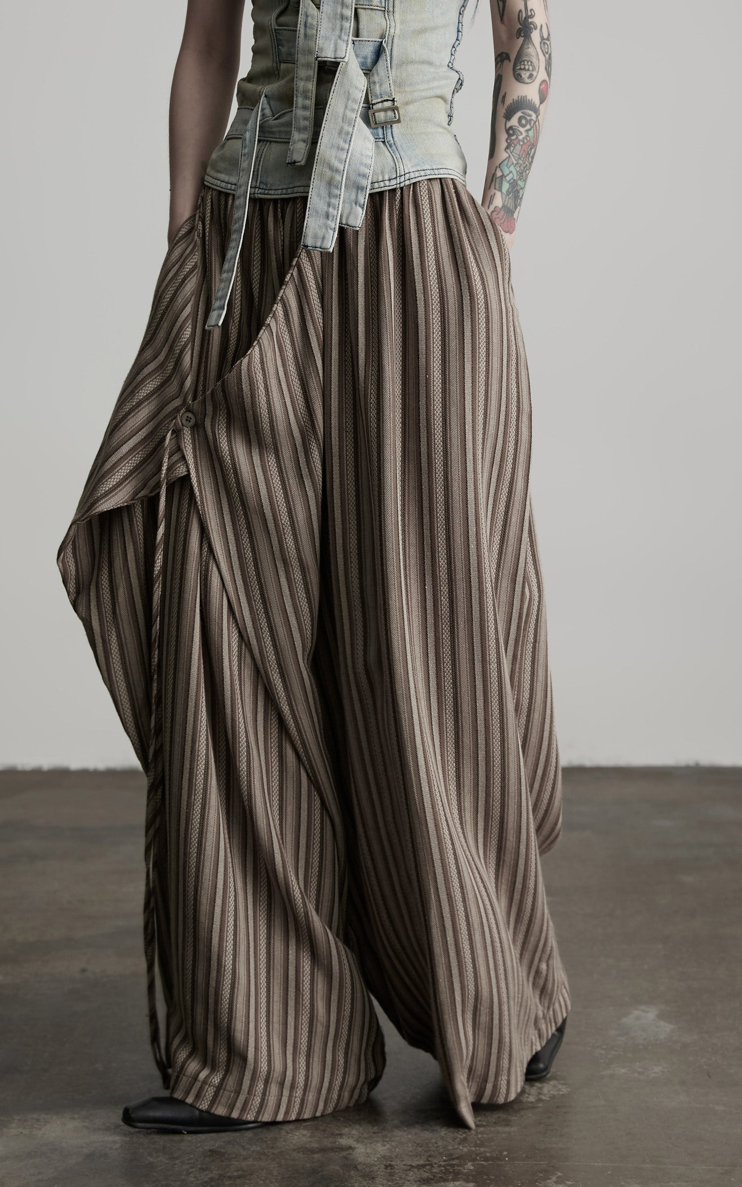 DOINDULGE Draped Asymmetric Wide-Leg Trousers in Textured Stripe