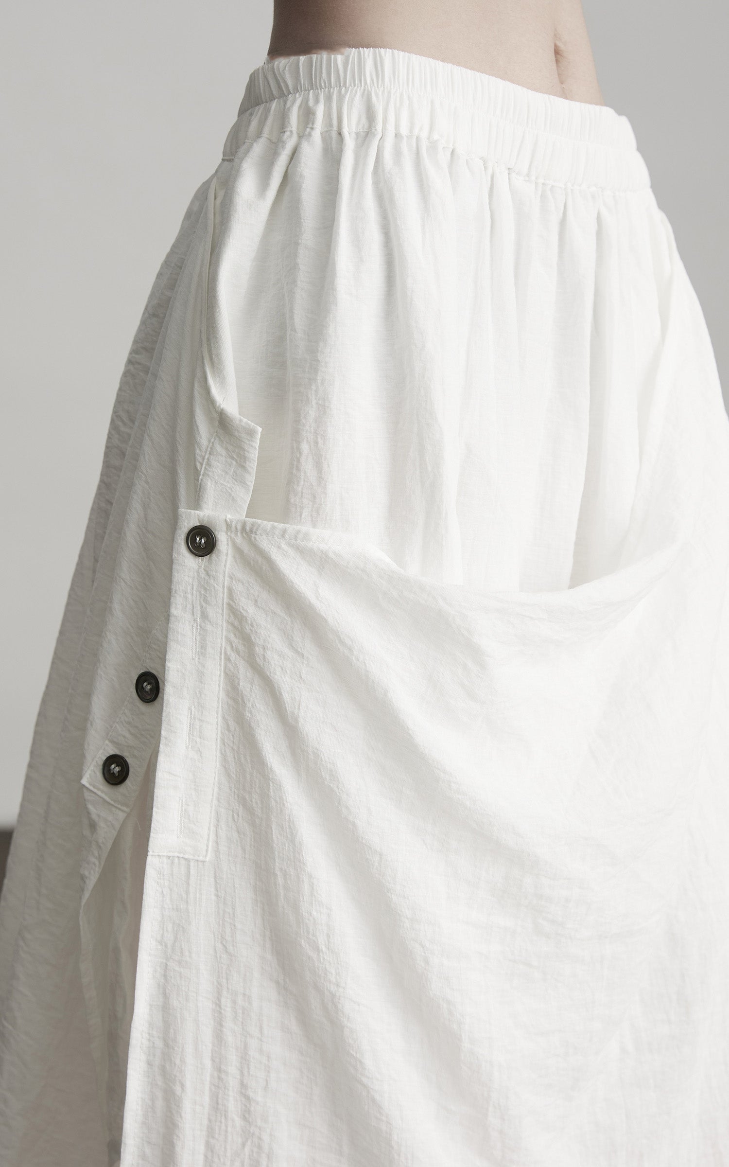 DOINDULGE Asymmetric Draped Skirt with Side Button Detail and Textured Cotton Layers
