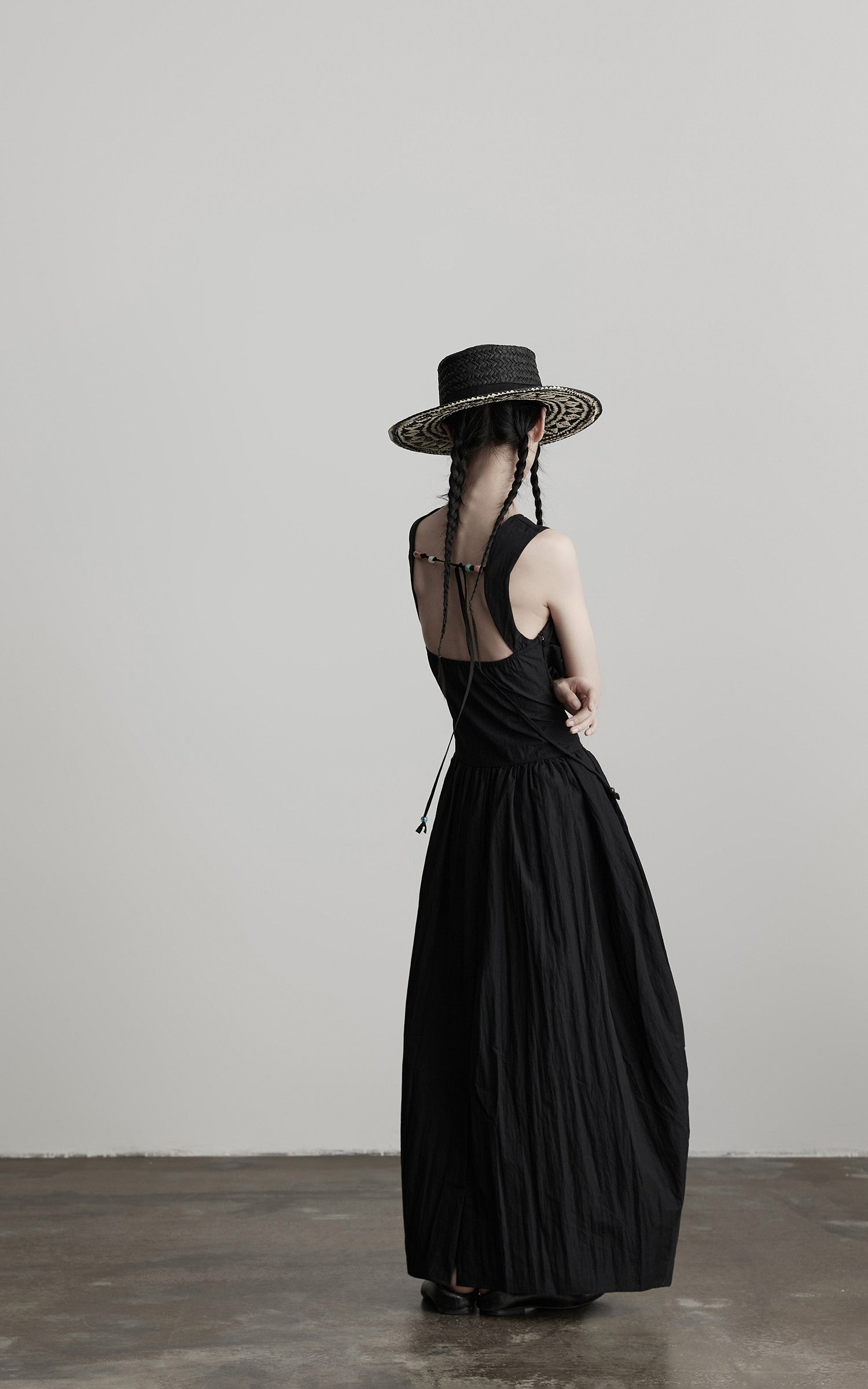DOINDULGE Sleeveless Draped Maxi Dress with Hand-Tied Bead Embellishment and Sculpted Waist
