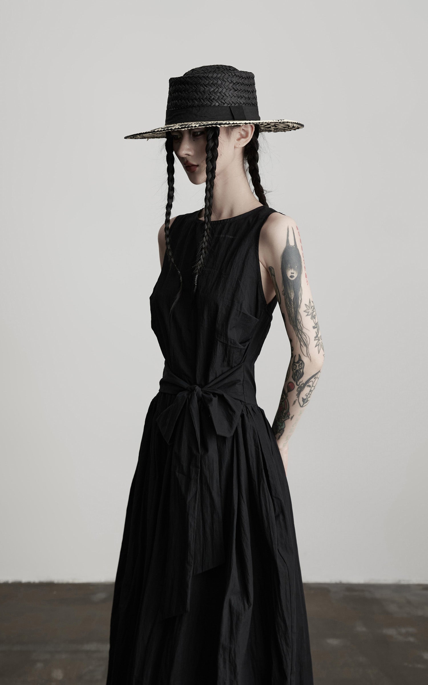 DOINDULGE Sleeveless Draped Maxi Dress with Hand-Tied Bead Embellishment and Sculpted Waist