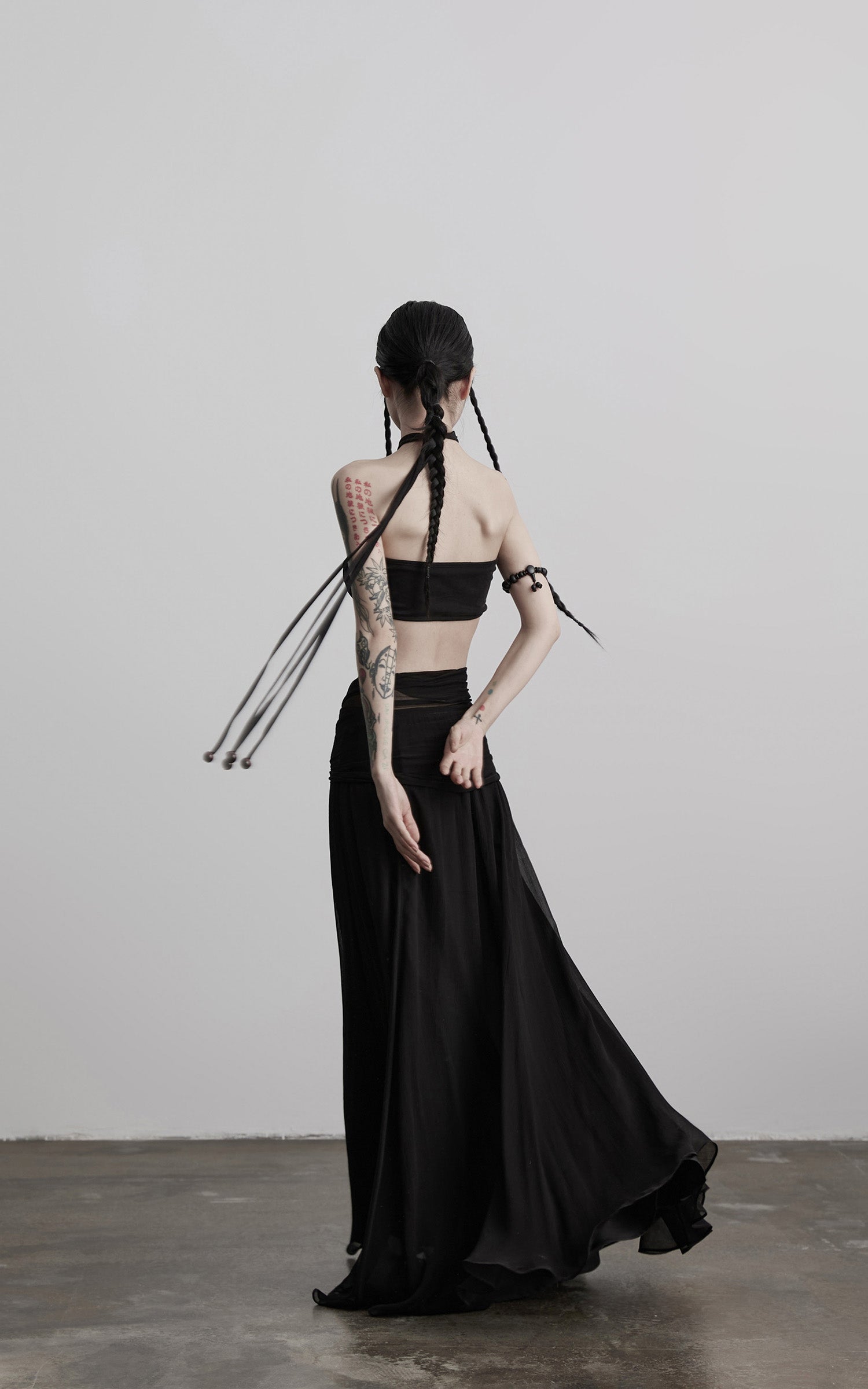 DOINDULGE Draped Maxi Skirt with Medallion
