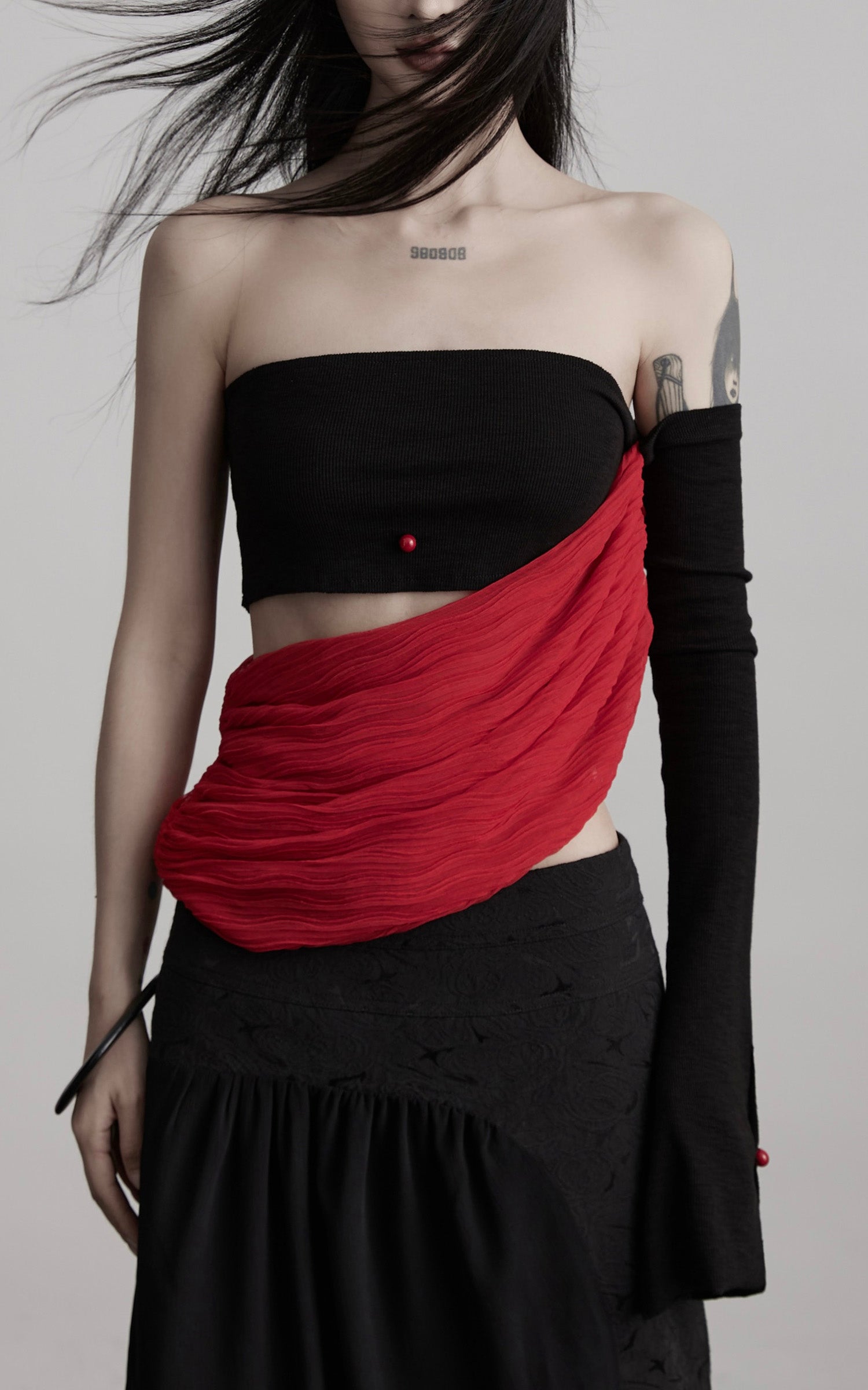 DOINDULGE Asymmetric Drape Top — Sculptural Red Pleats with Black Knit Base