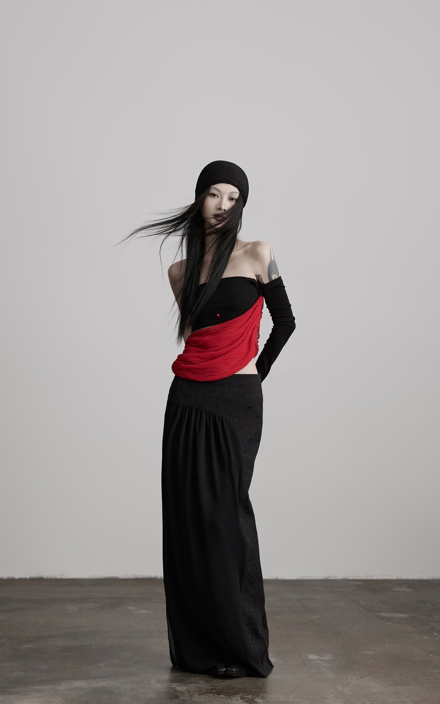 DOINDULGE Asymmetric Drape Top — Sculptural Red Pleats with Black Knit Base