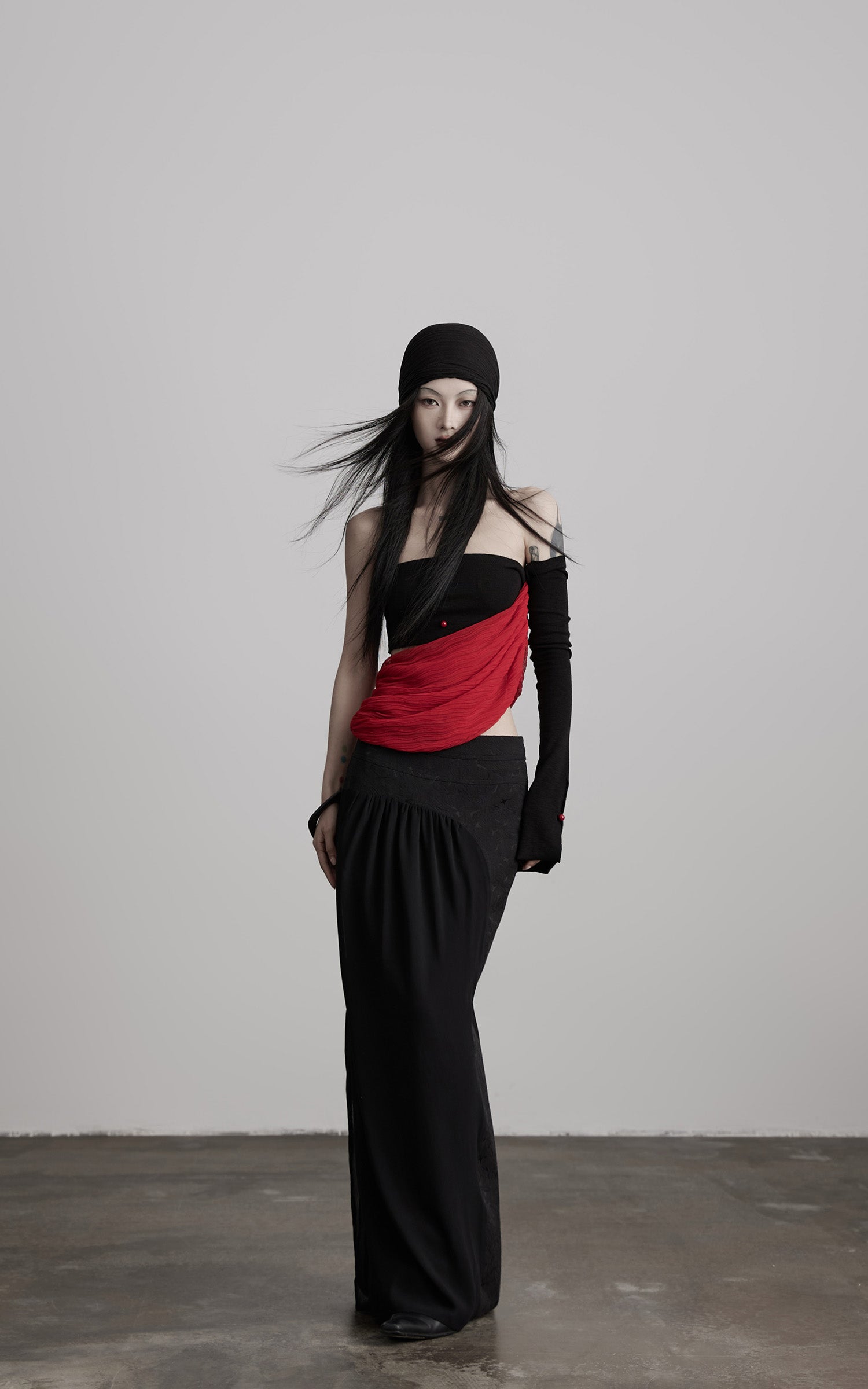 DOINDULGE Asymmetric Drape Top — Sculptural Red Pleats with Black Knit Base