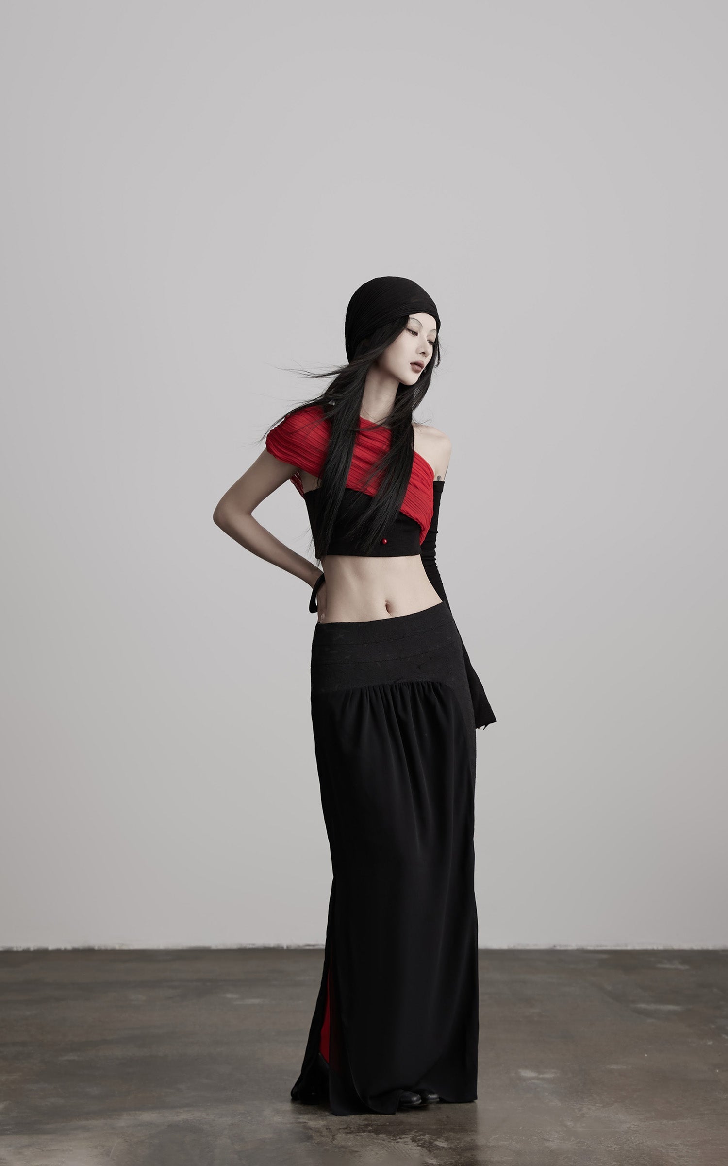 DOINDULGE Asymmetric Drape Top — Sculptural Red Pleats with Black Knit Base