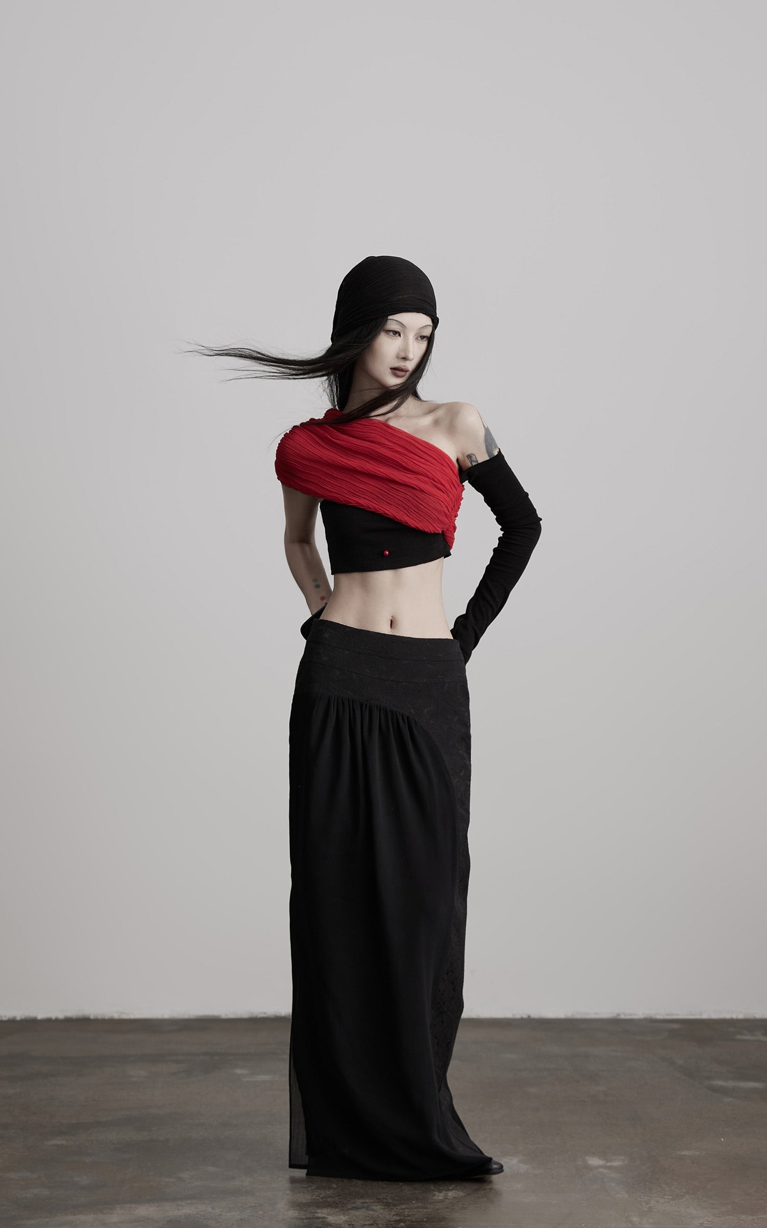 DOINDULGE Asymmetric Drape Top — Sculptural Red Pleats with Black Knit Base