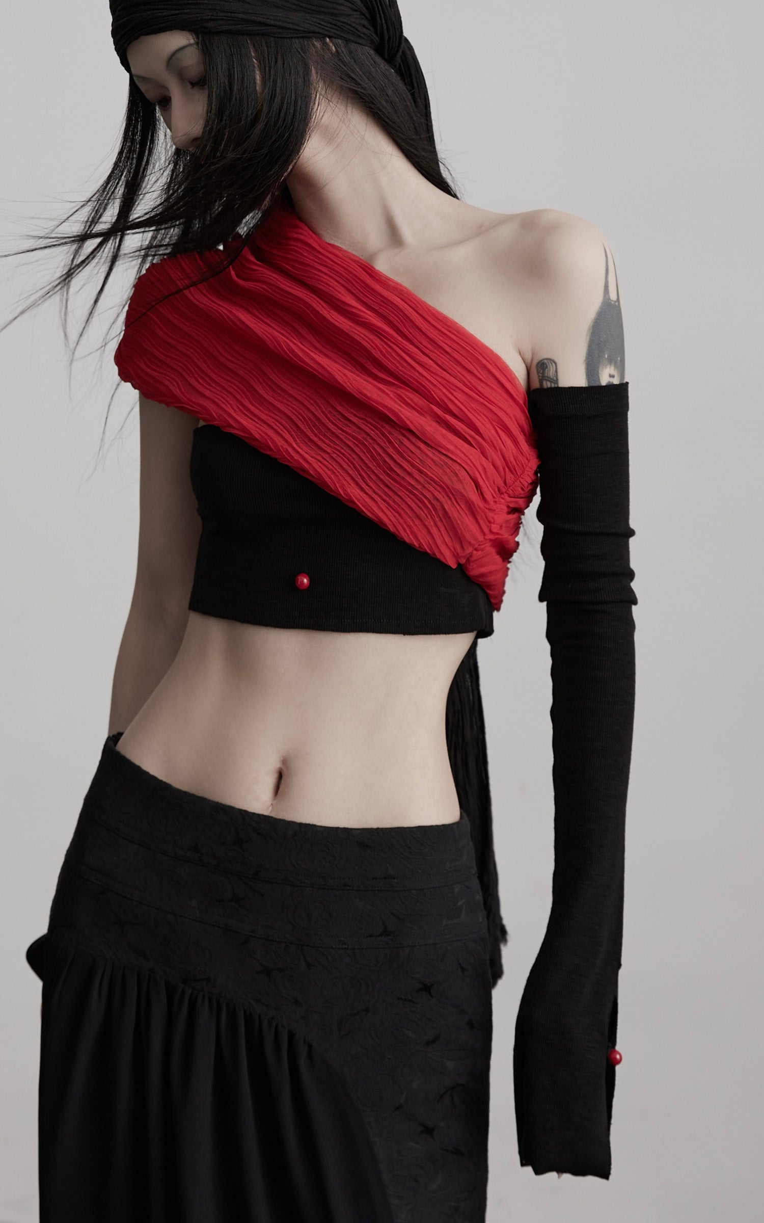 DOINDULGE Asymmetric Drape Top — Sculptural Red Pleats with Black Knit Base